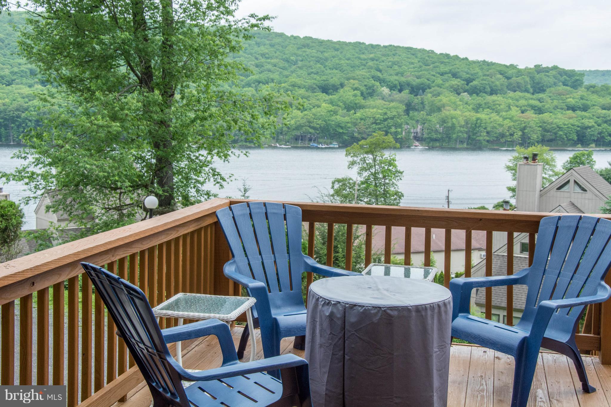 One of the BEST views at Roman Ridge! Spacious, 3 level end unit that is in nearly perfect condition. Open concept kitchen & living space, main level laundry, and views out of almost every window. Experience all four seasons of Deep Creek Lake without breaking the bank. Dock slips can be leased through High Mountain Sports right across the street! This is a must see unit!