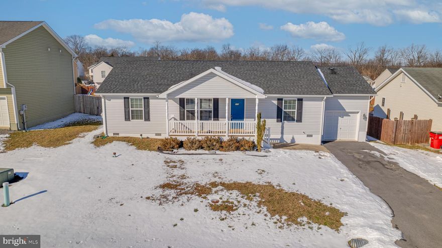 Discover the charm and comfort of this beautiful 3-bedroom, 2-bathroom rancher, perfectly designed for easy living. Step into the inviting main living area, featuring elegant hardwood floors that create a warm and welcoming atmosphere. The efficient galley kitchen offers plenty of storage, counter space and cabinetry, making meal preparation a breeze. Each of the three generously sized bedrooms is carpeted for added comfort, providing cozy retreats at the end of the day.
Outdoor living is a delight with a large rear deck, ideal for barbecues, gatherings, or simply relaxing in the fresh air. The backyard is fully enclosed with a durable vinyl privacy fence, offering a secure and serene space for family, pets, or gardening. The covered front porch adds a touch of charm and is the perfect spot to enjoy your morning coffee or greet neighbors. 
Conveniently located near schools, shopping, and parks, this move-in-ready home combines neighborhood charm with modern convenience. Schedule your private showing today and make this rancher your new haven!
