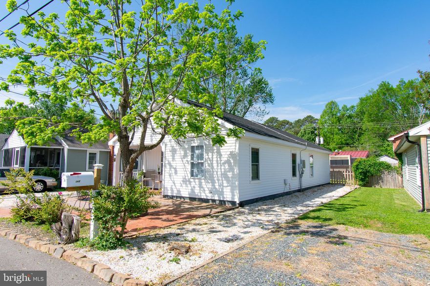 Charming move in ready cottage in the center of St. Michaels. Enjoy very low electric bills due to 2 year old solar panels on the roof.  This is an exceptional offering with a  modern kitchen, equipped with 5-burner gas stove, white upgraded cabinetry and stainless steel appliances. Bright and open living space plus a dining area off the kitchen and an updated bathroom with walk in, custom glass enclosed large shower. The house offers  3 bedrooms and a den. Enjoy the outdoors on a cozy covered porch,  a large brick patio with shade tree and fenced back yard. Off street parking at the side of the house. Fabulous location across from St. Michaels library, facing the community garden. Shops, restaurants, the farmers market and nature trail entrance are within a few blocks. Property zoning allows for home business. This attractive offering is suitable for a full time residence or a weekend getaway.