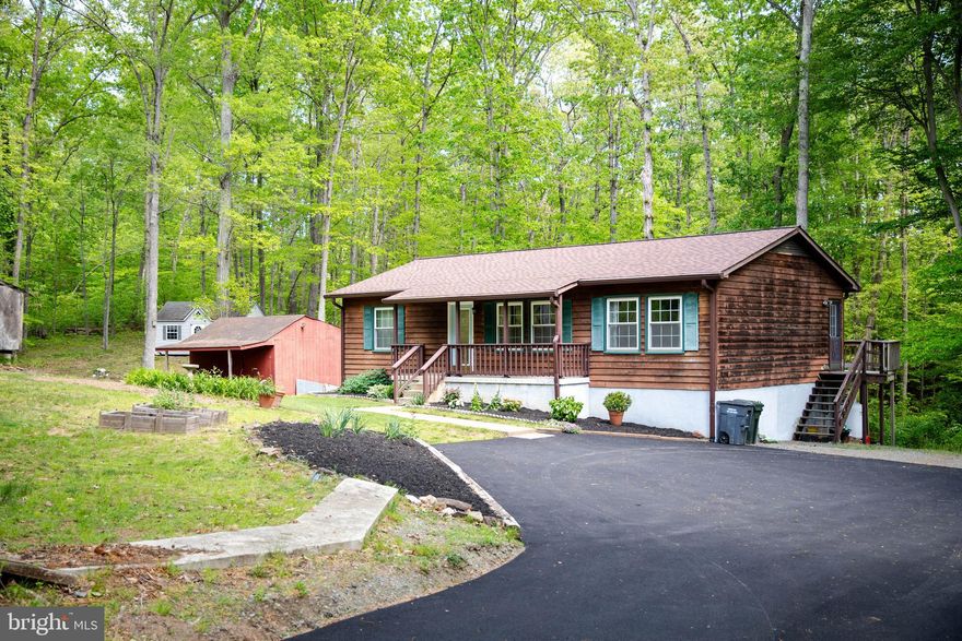 Welcome to 9505 Brentsville Rd, a unique and beautifully maintained home nestled on just under 3/4 acres of wooded privacy with NO HOA! Offering a rare opportunity, this home features an assumable mortgage at an ultra-low 3.25% interest rate. We have a lender if you need a 2nd to get this done.
This spacious 3+ bedroom, 3 full bath property provides 1,716 sq ft of finished living space plus 572 sq ft of unfinished potential. Included with the sale is the adjoining Lot expanding your outdoor sanctuary complete with mature hardwoods, tiered flower beds, and a tranquil creek that brings hummingbirds and wildlife to your doorstep.
Located just 200 yards from private lake access through the Bradley Forest Recreation Association (no restriction on boat size), this home is a dream for nature lovers and outdoor enthusiasts. Relax on the rear deck or porch, or enjoy two versatile outbuildings—one measuring 12' x 24' with tongue & groove walls and ceiling fan, the other a steel-reinforced storage shed large enough to accommodate a vehicle.
Inside, the home shines with quartz countertops (2025), Thompson Creek UV-coated windows  (2018), a new asphalt driveway (2025), roof (2021), HVAC (2024), sewage ejector pump (2025)—all the big-ticket items are done! The finished walk-out basement offers incredible flexibility with a full bath and kitchenette already in place, creating a perfect in-law suite, nanny quarters, home office, or simply more space for you.
With cedar siding, Fios internet availability, and a peaceful “country feel” just minutes from the VRE commuter train, Prince William Parkway, Rt 234, and local shopping, this property truly offers the best of both worlds. Whether you’re boating on the nearby lake, enjoying wildlife from your backyard, or exploring possibilities with the extra lot, this is a rare chance to own a private retreat that’s close to everything—just waiting for you!