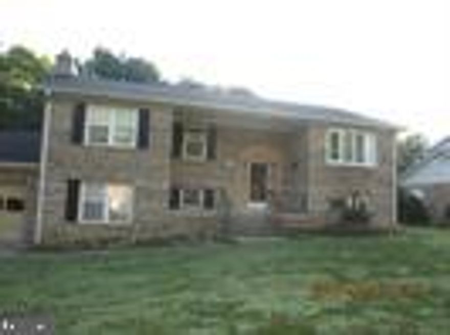 All brick large home on .37 acres in Clinton.  4 bedroom 3 full baths..  Large completely finished basement with built in bar with access to patio and In ground pool.  Huge open kitchen with modern accents including crown molding, stainless steel appliances, natural stone countertops, quiet energy efficient dishwasher.  Dining room and living room make this space ideal for gatherings.