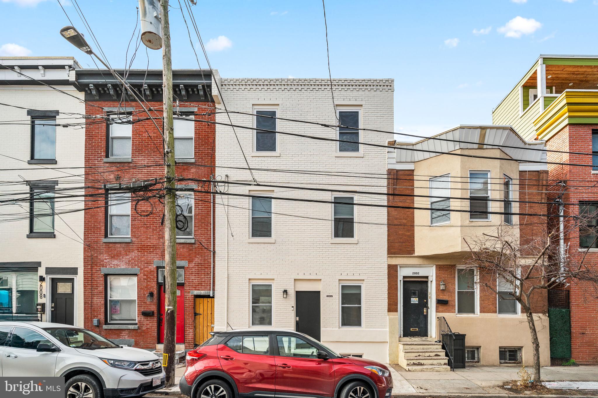 Welcome to this stunning, fully renovated 3-story row home, offering an 18-foot frontage and an ideal location in Fishtown, one of Philadelphia’s most desirable and vibrant neighborhoods. With a massive living space and an expansive 1,100 sq. ft. outdoor area, this home perfectly blends modern design, comfort, and functionality.
Step inside to discover gleaming hardwood floors and a thoughtfully designed layout that offers both openness and defined living areas. The spacious living room provides a welcoming retreat, while the separate dining and kitchen area creates an excellent space for gathering. The sleek kitchen features brand-new stainless steel appliances, quartz countertops and ample storage. A large sliding glass door floods the space with natural light and leads to the private backyard —perfect for entertaining, barbecues and relaxation. A stylish main-floor powder room completes this level.
The second floor features two generously sized bedrooms, beautifully designed two full bathrooms, and a dedicated laundry area, offering convenience and efficiency.
The third-floor owner’s suite is a true sanctuary, boasting a spacious bedroom, a large sitting are which can be converted into an additional bedroom, an oversized walk-in closet, and an en suite bathroom with a glass-enclosed shower, double vanity, and premium finishes.
The unfinished basement has been cleaned and well-maintained, providing excellent storage space or potential for future customization. A two-zone heating and cooling system ensures year-round comfort.
Beyond the home’s impeccable features, the location is unbeatable. Just steps from Fishtown’s renowned restaurants, coffee shops, breweries, and boutique shopping, you’ll be at the heart of one of Philadelphia’s most exciting communities. With easy access to public transit, major highways, and nearby parks, this home offers the perfect balance of city convenience and modern luxury.
Don’t miss this rare opportunity to own a beautifully designed home in an incredible neighborhood.