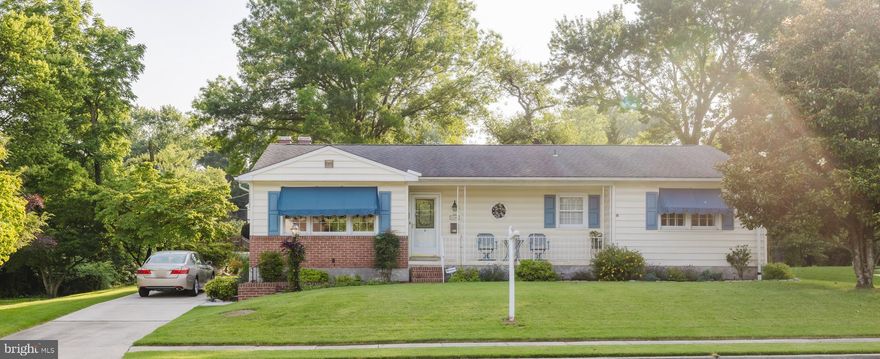 This lovely rancher in sought after Village Green is a 3-bedroom, 2.5-bath home that offers a rare combination of timeless charm and thoughtful updates. Pride of ownership abounds. 
From the moment you arrive, you’ll appreciate the home’s stunning curb appeal which includes a front porch and tranquil surroundings and a picturesque stream just beyond the backyard—a perfect touch of nature.
Step inside to find the updated eat-in kitchen with granite counter tops, ceramic tile floor and abundant cabinet space that is open to a large breakfast nook that walks out to the deck.  Plantation blinds are icing on the cake. The updated bathrooms blend modern convenience with classic design. The custom ceramic tile surround was replaced in 2019, offering a clean, contemporary feel. The remodeled lower level offers a very spacious family room and cozy gas fireplace where many memories have been made.  In addition there is a convenient half bath, laundry  and abundant storage.  The outdoor living is just as impressive.  Spacious Deck overlooks stream and expansive yard.  There is Baltimore Bounty open space on one side of the property that gives this home us of a double lot and more privacy. The Deck is a low-maintenance Wolfe deck and rails with motorized awning (2025) added to maximize comfort and shade on sunny afternoons. You won't want to miss this great value and location with walkability to Valley Swim and Tennis Club, Riderwood Elementary for tennis and playground, the farm store, and more.  A community worth exploring.