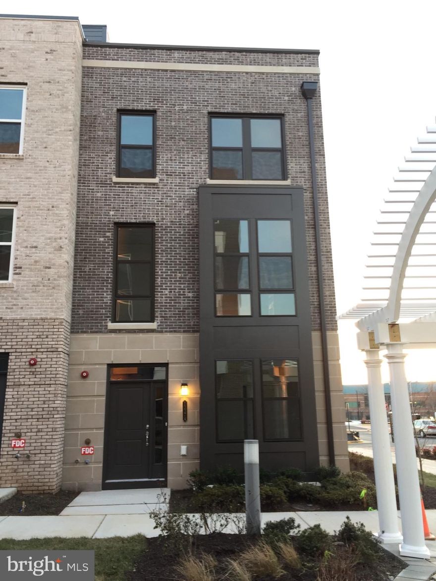 4 levels with 3 bedrooms, four & 1/2 baths, huge finished loft with walk out roof top terrace.  Convenient & walking distance to  metro stations.  Upgraded gourmet kitchen with hardwood floors on main level.  2 car garages plus street parkings.  4 years  old property.  washer and dryer included.  Remove your shoes before entering.  MUST BE NON SMOKER AND NO PETS