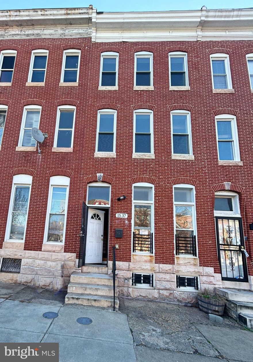 Nestled in the neighborhood of Broadway East, this colonial townhouse blends classic architecture with modern comfort. Spanning 2,866 sq. ft. of living space with vinyl plank floors and exposed brick walls, this residence shows a touch of style and warmth. The kitchen, with ample table space that features white custom-made cabinetry, granite countertops, and stainless-steel appliances, is a culinary enthusiast's dream. With three generously sized bedrooms and four full bathrooms plus a convenient half bath, this home ensures comfort and privacy for everyone.  The unfinished basement with multiple access points, providing potential for customization to suit your needs, whether for additional living space or storage. Externally, the home is framed by classic brick construction, with inviting sidewalks and streetlights enhancing the neighborhood's charm. The rooftop deck with spectacular view of the city, is a perfect place for gathering or outdoor activity. Don't miss this exceptional opportunity to make this Broadway East gem your home!