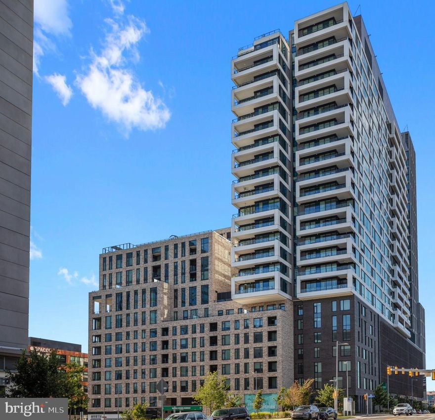 Private, larger storage unit, a perk that not all units have! Designated parking spot in garage!

Experience elevated living in this stunning 1-bedroom, 1.5-bath residence at the Verse in the heart of Tysons. Located on the 14th floor, Unit 1404 offers breathtaking panoramic views through floor-to-ceiling windows that flood the space with natural light.

This beautifully appointed home features an open-concept layout with high ceilings and a modern gourmet kitchen complete with granite countertops, stainless steel appliances, and a spacious breakfast bar—perfect for entertaining. The expansive living area flows seamlessly, creating an inviting and sophisticated atmosphere.

The generously sized primary suite includes a walk-in closet and a luxurious en-suite bath with dual vanities and a glass-enclosed walk-in shower. A convenient half bath for guests and in-unit washer and dryer add to the home’s comfort and functionality.

Residents enjoy resort-style amenities including a 24-hour concierge, fitness center, club room, and more. Ideally located just moments from Tysons Corner, Metro access, fine dining, shopping, and major commuter routes.

Luxury, convenience, and style—this is Tysons living at its finest.