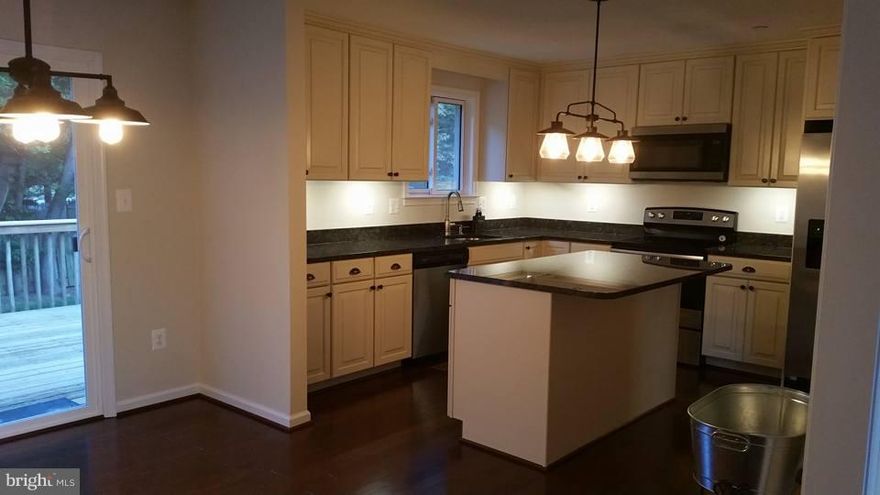 Beautifully renovated from top to bottom- 3BR 2.5BA  New roof, upgraded kitchen cabinets, granite counter tops, SS appliances, hardwood floors, new HVAC, sprinkler system, carpet, doors, new baths w/ tile, finished basement...Absolutely perfect!