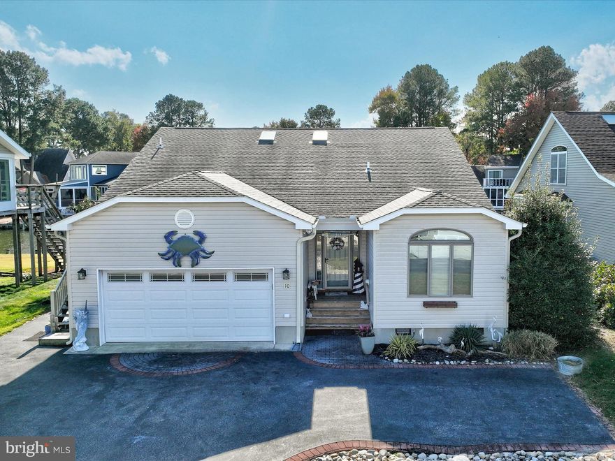 Welcome to 10 Waters Edge, a stunning waterfront residence in the highly desirable Ocean Pines community along Maryland’s beautiful Eastern Shore. This sought-after enclave spans nine miles of waterfront and lush woodlands, offering an impressive array of amenities, including a yacht club, a championship golf course, 5 swimming pools, aquatic classes, scenic nature trails and much more. With 60 feet of full bulkheaded, deep-water frontage, this remarkable home provides direct canal access to Isle of Wight and Assawoman Bay, making it a dream for boating enthusiasts. The curb appeal is unmatched, with meticulous landscaping and a welcoming covered entrance inviting you to explore all this exquisite home has to offer. Step inside to find a seamless blend of contemporary architecture and coastal charm, thoughtfully designed to capture the essence of waterfront living. Natural light illuminates each space, drawing you to the living room with its soaring vaulted ceiling and expansive picture windows framing serene water views. Anchored by a beautifully appointed fireplace, the living room is an inviting space for gatherings with family and friends. The grand pass-through to the kitchen and dining area enhances the spacious feel of the home, creating an entertainer’s dream. The gourmet kitchen is a chef’s delight, equipped with extensive granite countertops and ample prep space, perfect for culinary creations. Enjoy meals in the adjacent dining area, on the screened porch with panoramic water views, or step out to the elevated deck to dine alfresco, taking full advantage of the coastal setting. Retreat to the serene primary suite, a sunlit haven featuring a generous walk-in closet and an ensuite spa-inspired bath with a soaking tub, stall shower, and dual vanities. On the main level two guest bedrooms, a well-appointed hall bath, and spacious laundry room complete the 1st floor layout. Upstairs, a charming loft space offers versatile options such as a family room or potential fourth bedroom, complemented by two large walk-in storage areas and additional attic space above the garage. This exceptional residence also offers an expansive outdoor living experience, complete with multiple gathering areas, a private dock, a boat lift, and a double galvanized jet ski/kayak lift. Embrace coastal living at its finest at 10 Waters Edge. Schedule your private tour today to discover this incredible waterfront retreat!
The Ocean Pines resort community offers an impressive array of amenities that include, a championship golf course, scenic nature trails, five pools with aquatics programs, beachfront restaurant in Ocean City, yacht and beach clubs, marinas, a premier racquet sports complex, community activities throughout the year, farmers & artisans’ markets, gift shop and so much more.