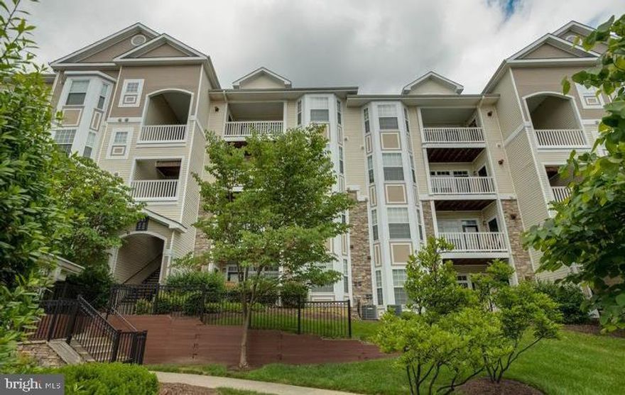 Pristine condition. New Hardwood floors, Fresh Paint. Private balcony overlooking woods..  Easy access to the Greenway-----Community includes POOL, Exercise Facility and more!!