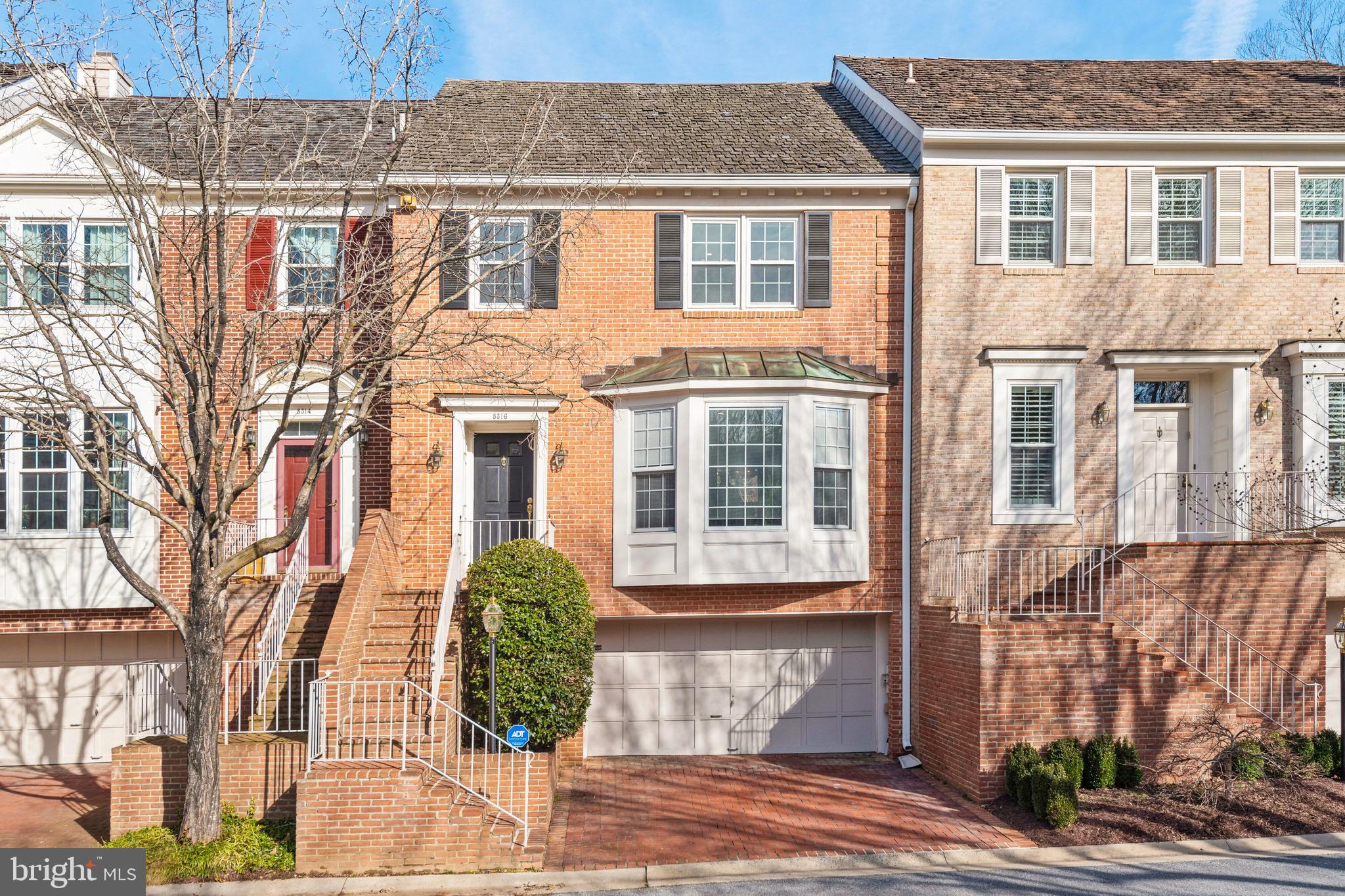 Tucked into the highly sought-after Riverhill community, this elegant 4-level brick townhouse offers timeless design, modern upgrades, and an unbeatable location just minutes from downtown Bethesda, Potomac Village, and major commuter routes.
Step inside to find a beautifully appointed main level with refinished hardwood floors, a bright open-concept living and dining area, and a tastefully renovated kitchen. Featuring quartz countertops, a glass tile backsplash, porcelain tile flooring, and premium stainless-steel appliances from Miele, Bosch, and KitchenAid, the kitchen is both stylish and functional and includes a breakfast area overlooking the patio. Adjacent is a warm and inviting family room with a wood-burning fireplace and access to a charming brick patio—perfect for relaxing or entertaining.
Upstairs, the spacious primary suite is a true retreat with cathedral ceilings, expansive closet space, and a spa-like en-suite bathroom offering dual vanities, a soaking tub, and a separate shower. Two generously sized secondary bedrooms and an updated hall bath complete this level. On the top floor, a finished attic provides versatile living space that can be used as a fourth bedroom, home office, gym, or studio.
The fully finished lower level offers even more flexibility with a recreation room, a half bath, laundry area, and access to a two-car garage.
Recent updates include a new roof and gutters, many recessed lights, water treatment system, and a new washer and dryer—ensuring comfort and peace of mind for years to come.
Riverhill is a close-knit community known for its peaceful tree-lined streets and seasonal neighborhood events. With proximity to parks, trails, top-rated schools, and shopping and dining destinations, 8316 Rising Ridge Way is the perfect blend of luxury, functionality, and convenience.
Available July 1 2025