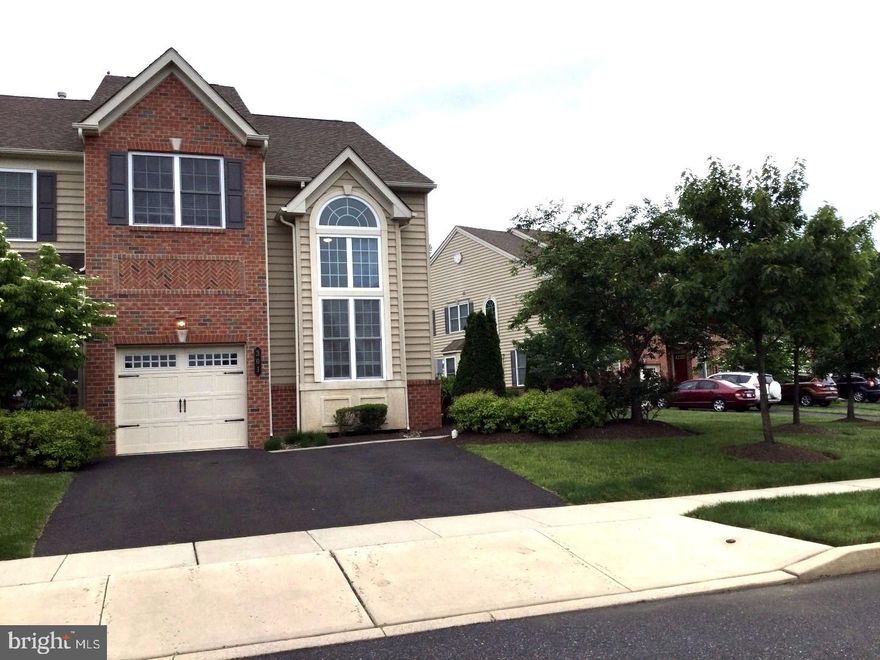 Absolutely beautiful W.B. Williamsburg END UNIT townhouse in desirable Upper Gwynedd community of Sturbridge Village.  End unit with side entry to hard wood balcony entry foyer the lighted 2nd floor palladium windows, dramatically vaulted living room ceiling warms the guests grand welcome.  Open 2 story Living Room balcony overlook from 2nd floor and dining room, are perfect for family or intimate dining.  Dining room is accented with light from the bumped out bay window.  Family room features hardwood floor, gas fire place where you can relax and enjoy overlooking open space, French door to rear patio for outdoor living.  The Family Room opens to the newly updated kitchen that features center Island with breakfast bar, granite counter top, back splash, and dining area provides perfect convenience for any household.  Master Bedroom Suite offers an owner's retreat with vaulted ceiling, large walk-in closet, full bath with double bowl vanity, soaking tub, stall shower.  Two other nicely sized additional bedrooms, Hall bath and the convenience of a 2nd floor laundry room complete the 2nd level.  The third level features a finished loft with skylights, ideal for an office/4th bedroom.  A convenient and quiet location, close to Merck, commuter Train, Shopping, Dining, and Parks.