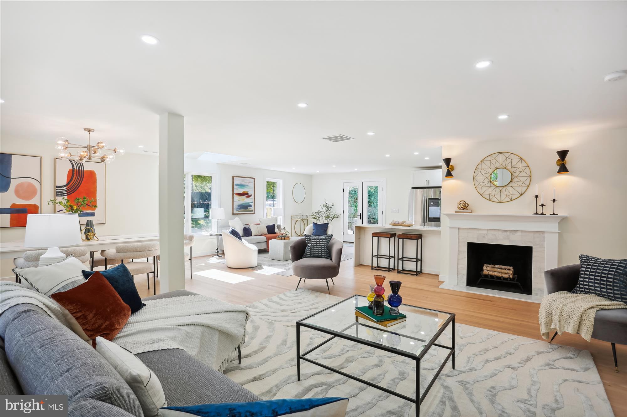 This airy, open, and spacious 3-bedroom 2.5-bathroom Mid-Century Contemporary is the newest creation by Alex Boyar of AB-Urban Development, a decades-long curator of smart residences with style. Transformed from top to bottom, this special residence offers the best model of one-level living with its dramatic expanse of openness, eliminating the obstruction of walls and stairs! Open the door to a welcoming foyer that flows to a stately living room with a fireplace and a grand dining room that can seat twelve. The new white-on- white kitchen with quartz dine-in bar and skylit family/gathering room spill through French doors to the welcoming and pleasingly private flagstone patio and lovely, landscaped backyard. The primary bedroom suite is a serene sanctuary with space for an office or sitting section. The generous driveway can accommodate four cars. The superb corner location is a breeze to Bethesda urban amenities, river activities, and quick access to I495 and Clara Barton Parkway.