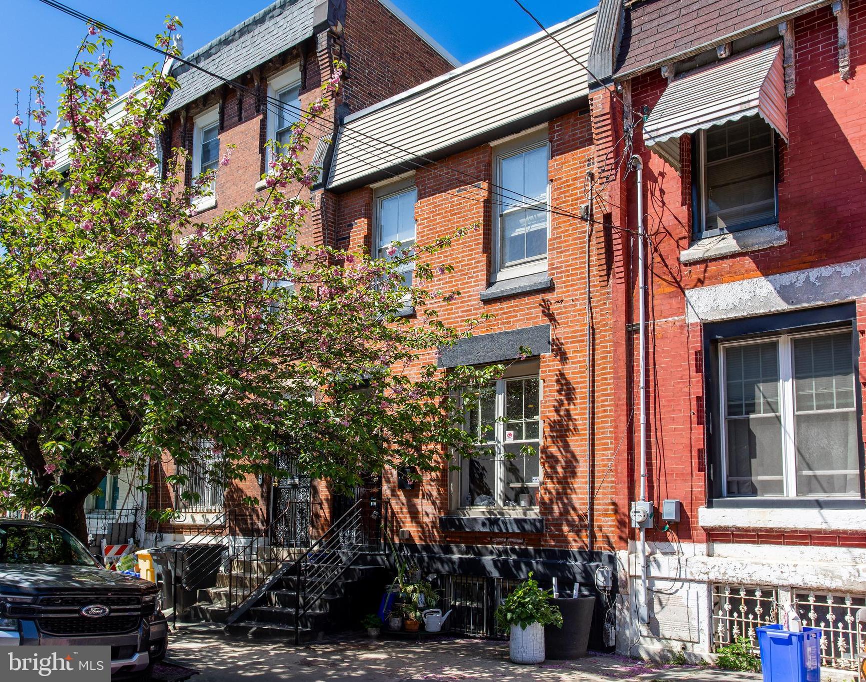 Welcome to 2325 W Thompson Street, a beautifully updated 3-bedroom, 2.5-bath townhome located in the heart of vibrant Brewerytown, Philadelphia. This stylish and move-in-ready home offers modern finishes, flexible living space, and an unbeatable location close to shopping, dining, and Girard College. Step inside to a bright and open living room featuring durable wood flooring that continues throughout the home. The living area flows seamlessly into the dining space, complete with a ceiling fan and plenty of room for entertaining. Toward the rear, the modern kitchen impresses with a center island topped with quartz countertops, stainless steel appliances, a sleek range hood, built-in microwave, and ample cabinet space. A convenient powder room completes the main level. Upstairs, the primary bedroom offers a peaceful retreat with wood flooring, a ceiling fan with light, and a private en-suite bathroom featuring a contemporary step-in shower. Two additional bedrooms on this level also include wood flooring and ceiling fans—ideal for guests, kids, or a home office. A second full bath with a tub/shower combo serves these rooms, and a laundry closet with stacked washer and dryer provides ultimate convenience. The finished basement offers a cozy family room—perfect for movie nights, a play area, or additional entertaining space. The spacious backyard features a patio and garden area. Located just steps from Brewerytown’s popular amenities, local eateries, and public transit, this home offers both comfort and urban convenience. Only a 15 minute walk to Fairmount and 20 minutes to the Art Museum! Don’t miss your opportunity to own this beautifully updated home in one of Philly’s most exciting neighborhoods—schedule your tour today!