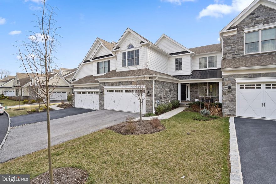 Welcome to this turnkey lifestyle at the sought after community of Liseter.  This interior FIRST FLOOR PRIMARY SUITE carriage home was built in 2020 and boast over $140,000 in upgrades.  As you enter the home you are greeted with a dramatic 2 story foyer that flows seamlessly into the dining room with custom draperies. The home has beautiful hardwood floors throughout the main living area, primary suite and upstairs loft and hallway.  As you make your way to the family room you are greeted with a wall of windows allowing the natural light to flow in and the slider provides access to the outside deck with an expansive view of the common area. Custom built in bookcase surrounds a gas fireplace that brings a sense of warmth and coziness to the room. The beautiful kitchen that any home chef will appreciate with a JennAir appliance package, Bosch refrigerator, quartz counter tops, and an expanded kitchen island that allows plenty of space for prepping and entertaining.  The first-floor primary suite is off the family room and has beautiful hardwood floors, a vaulted ceiling, and large windows with transoms.  You will find his and her walk-in closets with ample space and lead you to the primary bathroom with quartz-top double vanity an extra-large shower with a bench and frameless glass shower enclosure.  A powder room, a large laundry area, and entry from the 2-car attached garage complete the first floor. As you make your way upstairs the hardwood floors continue throughout the large loft area that is currently being used as an office.  There is also an additional hall bathroom with a double vanity and a bath/shower combo.  The 2 additional bedrooms are large with ample closet space and lots of natural light flowing in.   The very large walk-out lower level is unfinished and offers many possibilities.  The Homeowner’s association is responsible for landscaping, snow removal, and trash collection.  It truly is a turnkey community with an abundance of amenities including infinity edge pool, state of the art gym, walking trails, pickle and tennis courts, a club house with yoga and meeting rooms, and outdoor pavilion that hosts concerts and an award winning, 9000sq ft historic 2 story carriage barn.  They host first Friday social for residents and many parties and functions take place at the carriage barn.  Liseter is centrally located with easy access to Rt. 3, shopping, restaurants, and the Main Line.