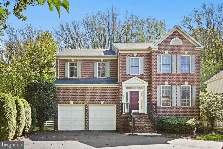 Beautiful, bright, and newly updated, brick Colonial, on three spacious, fully-finished levels, in Vienna's sought after Courthouse Commons! Be sure to check out the Virtual 3D, click-through tour link provided! Located on a premium pipe-stem, cul-de-sac, end-lot, you'll enjoy additional privacy, yard space, HOA lawn care/maintenance, snow removal, and parking for up to five vehicles, provided by the large, two-car garage (with extra-high ceilings), and the wide/expansive driveway, also great for basketball, roller hockey, and other activities! Guest parking is located just nearby if needed. As you enter the home, the open foyer greets you with abundant light from the many large windows, wood flooring throughout the main-level, lofty two-story ceilings, and an inviting, open living/seating room with bay window. The open concept, gourmet kitchen is centered by a spacious island/breakfast bar, and includes gleaming counters, plenty of generous cabinets, drawers, and a pantry for all your storage needs. Stainless-steel appliances include refrigerator, double wall ovens, built-in microwave, induction stovetop, and dishwasher. Enjoy coffee and relaxing meals while looking out the bay window of the informal dining/table space off the kitchen, or for formal occasions, the separate dining room, which can be easily doored to become a main level bedroom or office/study. Entertain guests or curl up with your favorite book and beverage in the lovely family room. Open to the kitchen, it features two-story ceilings, extra large windows, a gas fireplace with glass screen, marble hearth and mantle, and windowed door, providing access to a grilling deck and the rear yard. The upper-level features a large primary suite, complete with new wood flooring, ample space for an in-room lounge or office, and two separate, custom, walk-in closets. You'll find it easy to pamper yourself in the all new, luxury, primary en-suite bathroom, featuring all new premium fixtures, a free-standing soaking tub, large walk-in shower, and two separate vanities. In addition, the upper level includes three full-size bedrooms, each with generous closets, new full-size bathroom, new flooring throughout, and separate laundry room, complete with linen closet and shelving for storage! The enormous, fully-finished basement includes a den/theater room/guest space, all new full bathroom, and provides tons of open, versatile space to live, work, and play! Live nearby the many parks, playgrounds, entertainment, and all Vienna has to offer, including historic Church Street, with its excellent, local shops, cafes, and restaurants. Enjoy proximity to great events for all, like farmer's markets, Viva Vienna, and Chillin' On Church! Fashion, retail, and grocers abound such as Tysons Galleria, Tysons Corner, Starbucks, Whole Foods, Fresh Market, and Trader Joe's! Get anywhere quickly with easy access to Vienna Metro (Orange & Silver Lines), Washington D.C., Dulles & Reagan Airports, Union Station, the W&OD Trail, all major highways, express lanes, and plenty of other options. Brand new roof, with architectural shingles, includes a lifetime warranty and 5 year workmanship warranty, transfers to the new owner! New bathrooms include all new vanities, tile, toilets, and hardware. Electrical updates include all new Decora switches and outlets!  New HVAC heat pump/compressor installed about 2 years ago. New water heater installed about 5 years ago. New appliances include induction cooktop, dishwasher, and others replaced about 5 years ago. Welcome to this wonderful community and home!