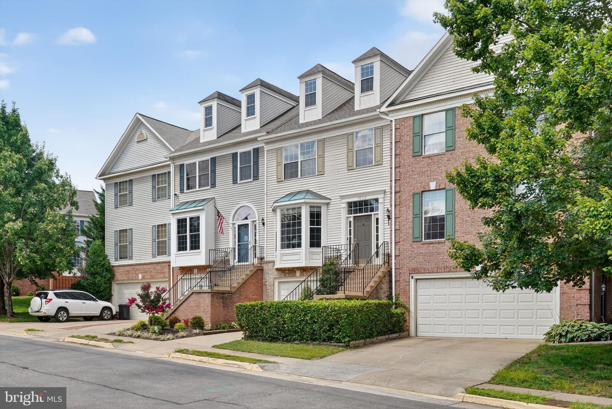 Beautifully maintained, this 3-bedroom, 3.5-bath townhome offers over 2,000 sqft of light-filled living space in the desirable Kingstowne community. The main level welcomes you with hardwood floors throughout and a bright, open layout that seamlessly connects the spacious living and dining area, complete with a charming bay window. The kitchen features classic white cabinetry, black granite countertops, a walk-in pantry, and an updated French-door stainless steel refrigerator. A sunny breakfast area opens directly to the rear deck, while a tastefully updated powder room adds everyday convenience. Upstairs, the private owner’s retreat impresses with a soaring vaulted ceiling and a versatile loft space, complete with skylight and abundant natural light, ideal for an in-home office or cozy lounge. The spa-inspired en-suite bath enhances this retreat, featuring a dual-sink vanity with granite countertop, custom-tiled walk-in shower, and a separate soaking tub. On this level are two additional bedrooms, each with large closets, and an updated shared full bath. The finished lower level offers a spacious rec room with a cozy gas fireplace and direct exterior access to the rear garden. Beautiful hardwood floors, recessed lighting, an updated full bath with tub/shower combo, and a dedicated laundry room with extra storage space make this a flexible space, well suited for long-term guests, an in-law suite, or a private office. Outdoor living is equally inviting, with a rear deck perfect for al fresco dining and a flat, fenced garden for play or gardening enthusiasts with no rear neighbors. Recent upgrades include a new roof (2024) with transferable lifetime warranty, Ring alarm system with coverage for all entries, Nest doorbell, and updated smoke/carbon monoxide detectors throughout. Residents of The Mews also enjoy access to community amenities including a swimming pool, clubhouse, tennis courts, and playgrounds with picnic areas. Ideally situated within minutes to Franconia/Springfield Metro, Ft. Belvoir, Kingstowne Town Center, Wegmans, and more!