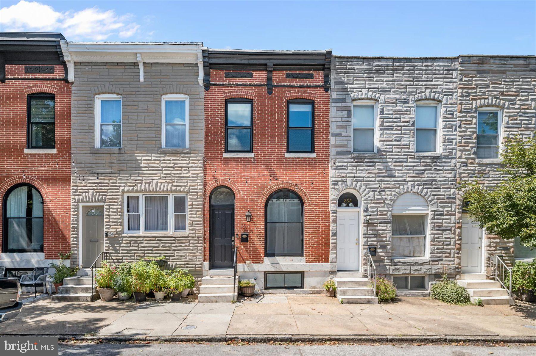 Beautifully renovated Patterson Park home with 5 years left on the CHAP Tax Credit! This spacious 4BR, 3.5BA home was fully renovated in 2019 with updated roof, HVAC, water heater, appliances, and more. Features include solid hardwood floors, crown molding, skylight, powder room on the main level, and a finished lower level with 2 bedrooms and full bath. Kitchen boasts 42” cabinets, gas stove, and 2019 appliances plus new washer/dryer (2023). Jacuzzi tub sold as-is. With its open layout and the longest footprint on the block, this home offers style, comfort, and an unbeatable location just steps from Patterson Park.
