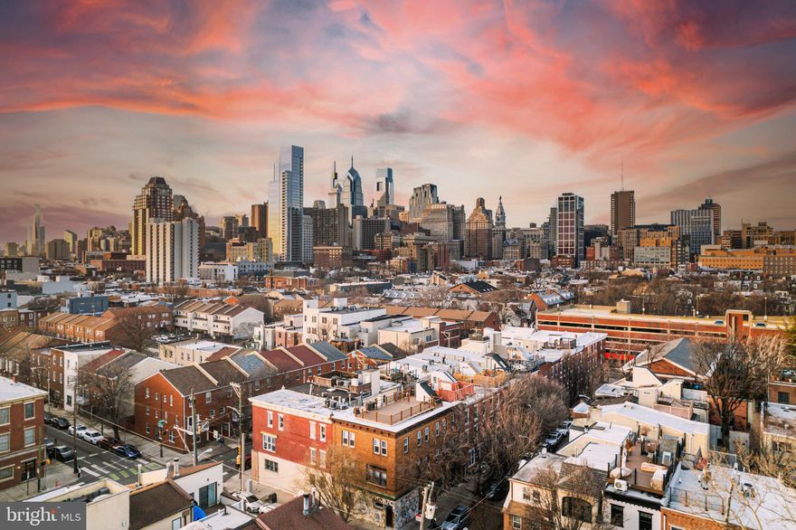 Discover 1035-37 Bainbridge Street Unit A, a rare versatile multi-family building in Philadelphia’s Bella Vista neighborhood bordering Washington Square West. This property easily offers the perfect blend of multi-generational living or rental income potential with modern city luxury! This adaptable property features two distinct living spaces plus an additional garage and lower-level den/entertainment space. It is an ideal opportunity for homeowners seeking flexibility, investors looking for an income-producing rental, or families wanting a separate private suite. Spanning multiple levels are 2 spaces that could be used as one home or individual units. The largest upper unit boasts 2 beds and 2 baths with a kitchen and dining areas! The spacious primary bedroom has an ensuite bathroom, skylight, and a seating area with dual closets with organization systems. The second bedroom has gorgeous floor-to-ceiling white built-ins, gets incredible light, and is directly across from a laundry closet equipped with a side-by-side new washer and dryer. The second full bathroom features a jacuzzi tub and shower, all fully updated. A cozy living room with a fireplace sets the perfect ambiance for relaxing nights. The fully updated kitchen has higher-end stainless steel appliances, white quartz countertops, and 2 tones maiden cabinetry. All spaces have access to a private deck that offers unobstructed, breathtaking city skyline views! The lower-level unit provides its own separate living space, complete with a Murphy bed, full bathroom, modern kitchen, and home office or flex space—ideal for extended family, long-term tenants, or Airbnb potential. Below the garage is a fully finished basement that adds even more possibilities, perfect for a home gym, movie theater, or den space, and has an additional full bathroom! Designed with style and functionality, this home has all-new interiors, so it's ready for move-in. Completing the home is a private garage with hand-painted floors, offering secure parking in the heart of the city.  A unique highlight of the property is its direct connection to Philadelphia’s famous Magic Gardens, with an original Isaiah Zagar mosaic art piece! With a Walk Score of 95, this location is a walker’s paradise, allowing daily errands to be accomplished on foot. Additionally, it boasts a perfect Transit Score of 100, indicating world-class public transportation options. With easy access to public transit, I-95, and major highways, this Bella Vista Beauty is a rare opportunity to own a versatile, property in one of Philly’s most sought-after neighborhoods.