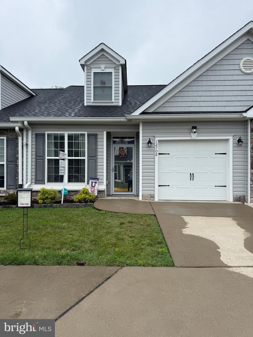 A real beauty.  Located in the active adult community of River Crossing Villas, this 2 Bed/3 Bath Villa is a MUST SEE! Built in 2017, the open floor plan includes stunning engineered wood floors, main level primary bedroom en-suite, a 2-story ceiling living room, a private office with glass French doors, full unfinished basement, upper floor with a loft and bath.  The main level features the office, kitchen, dining area, living room, primary bedroom en-suite, 2nd full bathroom and laundry area. The functional kitchen offers granite countertops, stainless appliances, a breakfast bar and elegant soft white cabinetry! The kitchen opens to the dining area and living room. The living room is comfortable and inviting with its’ 2-story ceiling and direct access to the backyard! The primary bedroom en-suite features a private bathroom, tray ceiling and walk-in closet! The primary bathroom was designed with style and comfort in mind with its’ extended double vanity and tiled walk-in shower! The 2nd level showcases an open loft that can be used as a crafts area, sitting room, 2nd office and more! You will also find another bedroom and 3rd full bathroom on the second level! All bathrooms have upgraded vanities with granite countertops! Need storage? Look no further…the huge unfinished basement offers you tons of storage and endless possibilities! But wait, there’s more…the low maintenance backyard features a lovely patio for you to enjoy! BONUS: Easy entry to home with zero threshold entry through the front door and/or garage.  Cameras are located at the front and rear door.  You can walk to  shopping   at Central Park and Wegmans.  A host of restaurants nearby and downtown Fredericksburg stores and  VRE train station just a short drive. plus easy access to I-95.