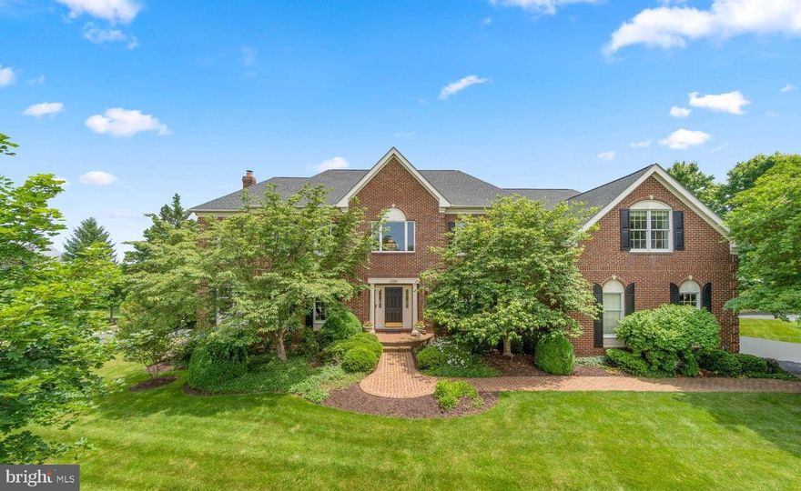 Situated in the prestigious Village of St. Andrews — widely regarded as the premier enclave of estate homes within the gates of  Belmont Country Club  — this exceptional Toll Brothers Master's Series residence commands one of the community’s most coveted settings.
Tucked on a quiet circular street just steps  from the clubhouse, the home is perfectly positioned on a rare, private half-acre lot with only one neighboring property, creating an uncommon sense of space, exclusivity, and retreat within the heart of the community. Mature tree screening enhances the sense of privacy while preserving a bright, open atmosphere filled with incredible morning light throughout the rear of the home and grounds.
With nearly 7,000 square feet of refined living space, this stately three-sides brick estate has been extensively upgraded with a level of quality and design curated for luxury living and elevated entertaining.
Inside, an elegant two-story foyer introduces grand-scale rooms, newly refinished hardwood floors, fresh designer paint, abundant natural light, and sophisticated Restoration Hardware lighting that create a timeless yet modern aesthetic throughout.
The gourmet chef’s kitchen is the heart of the home, appointed with premium Thermador appliances including a 6-burner range with griddle, dual dishwashers, warming drawer, steamer, pot filler, custom cabinetry, and illuminated accent details — all flowing seamlessly into an expansive family room anchored by a dramatic stone fireplace.
The upper level offers five spacious bedrooms and three beautifully updated baths, including a luxurious owner’s retreat featuring a private sitting room with fireplace, expansive custom closets, and a spa-inspired bath with steam shower and soaking tub.
Designed for exceptional entertaining, the fully finished lower level features a custom bar with integrated appliances including a wine refrigerator, microwave, warming drawers. The basement is complete with large recreation spaces, a stone fireplace, fitness area, bonus rooms, wine cellar and a full bath.
The stairs lead outside to a private resort-like backyard. Extensive hardscaping, curated landscaping, mature plantings, integrated outdoor audio, and over $30,000 in architectural and landscape lighting create an extraordinary evening ambiance throughout the grounds. Thoughtfully designed perennial gardens and herb plantings provide color, texture, and blooms throughout the warmer months.
The fully fenced backyard offers a rare combination of privacy, flat usable space, and future flexibility — including ample room to build a pool while still preserving expansive recreation and entertaining areas, a feature seldom found within Belmont.
A fully customizable Trimlight permanent exterior lighting system elegantly outlines the residence, allowing effortless seasonal and holiday illumination without ladders or temporary installations.
Additional luxury features include:
✔ Whole-home generator
✔Insulated and sealed attic for energy efficiency
✔ Smart home integration with security and exterior cameras
✔ Sonos multi-room audio system with outdoor speakers
✔ 3-car side-load garage with EV charging
✔ Dual laundry rooms
✔ Irrigation system
✔ Skylights and expansive windows throughout
Residents of Belmont Country Club may enjoy an unmatched gated lifestyle with championship golf, resort-style pools, tennis, dining, fitness, walking trails, and a vibrant social club atmosphere — all with HOA services that include lawn maintenance, internet, cable, and trash service.