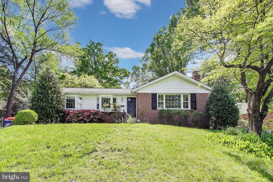 Charming brick home featuring a delightful four season sun room! This 3 bedroom, 2.5 bath home features beautiful natural oak hardwood floors and a step down living room complete with a large picture window that fills the space with natural light! The dining room connects to a spacious kitchen with ample cabinet storage and stainless steel appliances and provides access to a large four season sunroom addition with views of the serene, fenced in backyard. The primary bedroom offers a private en suite plus two additional bedrooms and a full bath. The lower level features a large rec room, a half bath, a bonus room perfect for an office and tons of storage. Located near parks, shops, dining and Rock Creek Park's many amenities including tennis courts, golf, and walking trails!