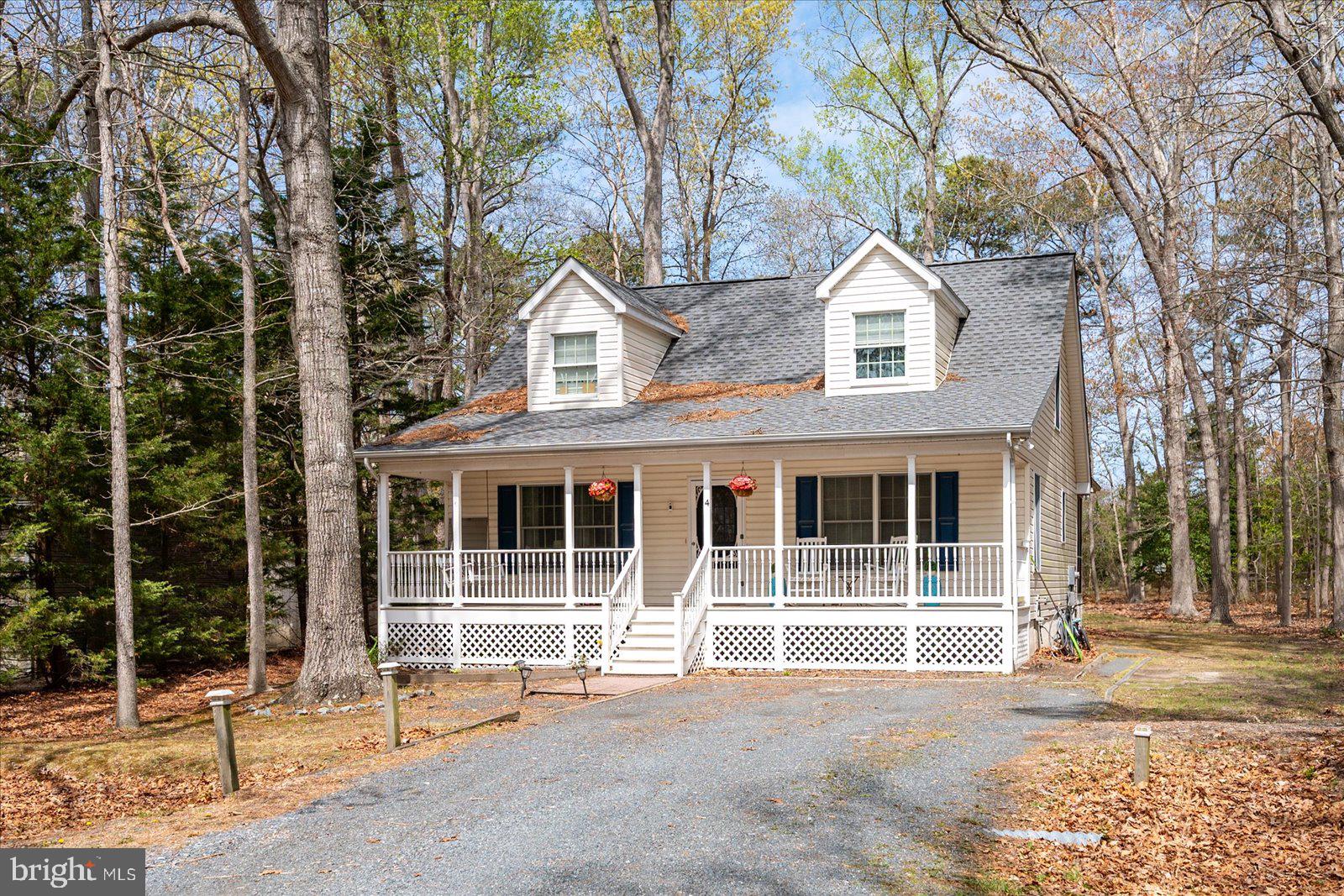 This charming 4 bedroom 2 1/2 bath home sits on 1/3 acre lot & on a cul de sac. Exterior features large front porch with swing, nice backyard with many trees removed, screened porch, roof & both (dual zoned) HVAC's replaced in 2022. Inside you'll find 2,150 sq ft of a really nice layout. First floor features two seperated living spaces both with gas fireplaces, open kitchen w/ island, half bath & laundry as well as a primary bedroom suite! Second floor has three gernerous sized bedrooms, full bathroom & bonus storage spaces. Come see this adorable home and everything Ocean Pines has to offer; 5 pools (one indoor open year round), private OP beach club w/pool in Ocean City, tennis courts, dog parks, many playgrounds, two fire stations, yacht club w/ live music all summer long, farmers market events & even a members golf course. Schedule you appt. right away!