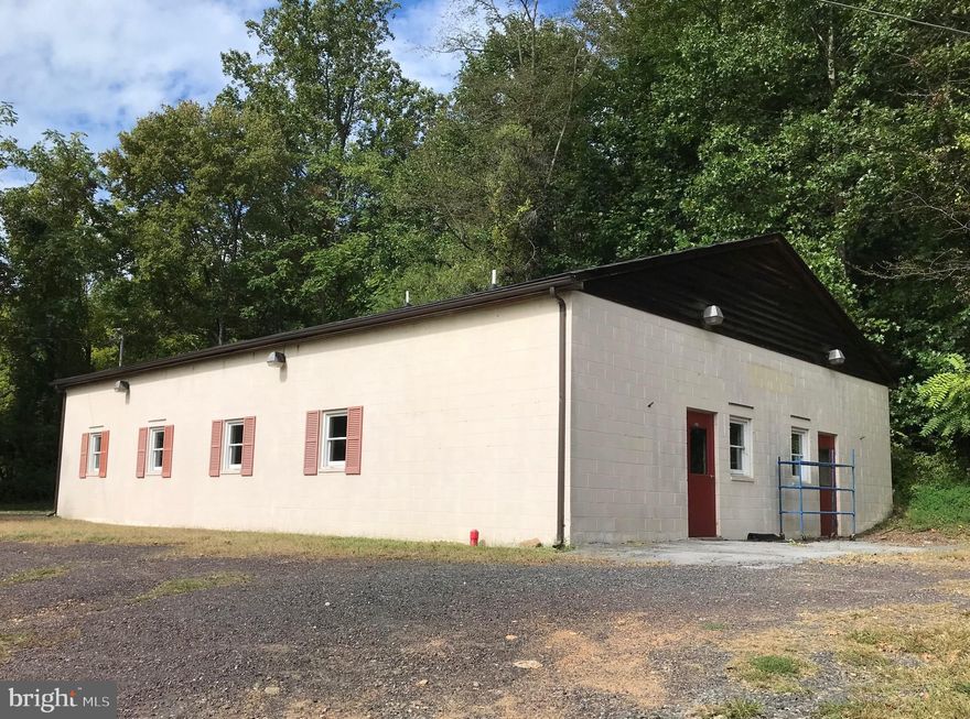 LOCATION! LOCATION! LOCATION!
2400 sq ft commercial building located right on Rt 211.  This versatile space is suitable for light industrial, auto repair shop, storage/warehouse facility, workshop, retail, etc.  15 ft ceiling height, 12 ft door height.  Gravel parking area. Interior features manager's office, reception area, and two partial baths.  Available immediately.