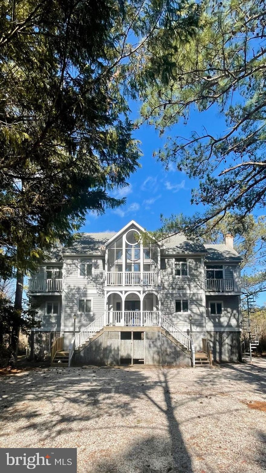 Rarely available, premier North Shores perimeter lot backing to state parkland with Ocean views!  This is the only property of its kind on the market.  Enjoy unobstructed views of the Atlantic Ocean, Cape Henlopen State Park and the protected wetland sanctuary of Gordons Pond.  Bring your imagination, and your architect, to take advantage of this fantastic opportunity to build your custom dream home in Rehoboth Beach.  The peaceful privacy of this .34 acre parcel will sooth you.  Watch the sun rise, and gaze at the stunning views as sunlight dances across the natural vista just outside your new home.  The lot offers room to build an expansive new enclave, or conceivably breathe new life into this unique 1990's home, past its heyday.  From the second and third floors of the existing house, the Atlantic Ocean can be seen off Whiskey Beach.  The current structure offers porches, verandas and balconies to connect with the surrounding nature.  A three story spiral staircase allows direct access to the primary suite and the outdoor elevator can bring groceries, beach coolers and dinner guests from the parking area to the second floor porch and third floor deck.  The existing 5 bedroom, 3.5 bath home is rich with character, awaiting renovation and is being sold "as is" with no warranties expressed or implied. Currently, the kitchen, living and dining areas along with the primary suite are on the top floor with the best vantage point of the surrounding scene.  Four (4) additional bedrooms and two (2) guest baths are located on the level just below.  Parking, storage and outdoor showers are on the ground level.  The prestigious coastal community of North Shores has 24 hour private security, its own beach patrol lifeguard crew for the private Ocean beach, a community pool, tennis courts, and a marina with pier and boat launch just off the Lewes Rehoboth Canal.  Gordons Pond / Whiskey Beach literally abuts this parcel, where the Junction Breakwater bike trail takes riders (and walkers) through Cape Henlopen State Park to Lewes and the Delaware Bay.   The property is priced at lot value.    The Board of North Shores has "first right of refusal", although rarely exercised