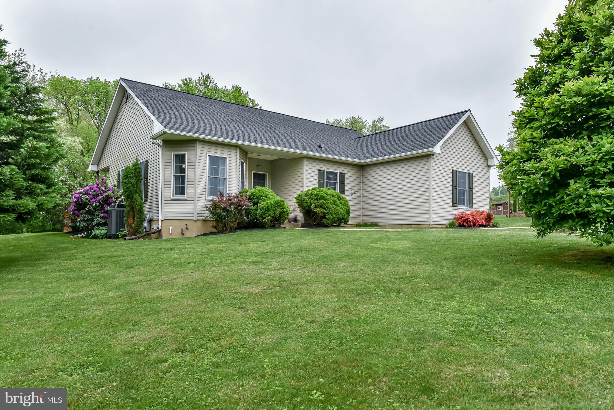 Spectacular rancher! Nine foot ceilings, heat pump with oil back up heat, new roof in September 2017, beautiful wood look laminate flooring, kitchen with ceramic tile floor and granite counter tops! Beautiful back porch and stamped concrete patio to enjoy!