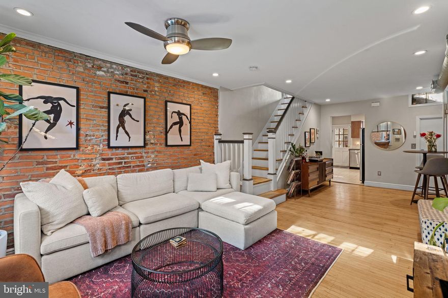 Unique Loft-like rowhome just a block from The Singing Fountain on E Passyunk Ave!  This home has modern updates and still maintains plenty of its original character and charm - from the floors to the banister and the exposed brick to the freestanding fireplace.  South facing windows in the living room brighten the open living and dining areas.  The kitchen is nicely appointed with flat front cabinets, quartz countertops and stainless steel appliances.  Out back, even the patio has unique details like the tulip mosaic and the rear brick wall, and serves as your private outdoor retreat.  The open concept owner’s bedroom has a wood burning fireplace and original floors.  As an added bonus, a skylight hatch not only provides additional light into the bedroom, it provides roof access for a future deck if you’d like to add one.  At the rear of the home, the second bedroom would make an excellent home office.  The bathroom has a large vanity with plenty of storage and counter space and a fully tiled shower with glass enclosure.  East Passyunk offers a plethora of local amenities like restaurants, cafes, bakeries, shops, grocery, gyms, and more.  This home is conveniently located two blocks from the subway to Center City and only one block away from East Passyunk Ave!  Your new hot spots will be neighborhood favorites like Superette, El Chingon, The Dutch, Stateside, Ember & Ash, Barcelona, Cantina, Human Robot, Rival Bros, Vanilya, Milk Jawn, and so many others.