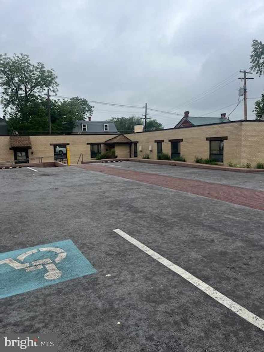Gated Commercial Space, ample paved parking, Building has approximately 4,000  sq. ft. with a lower level walk out space. LA must accompany showings.