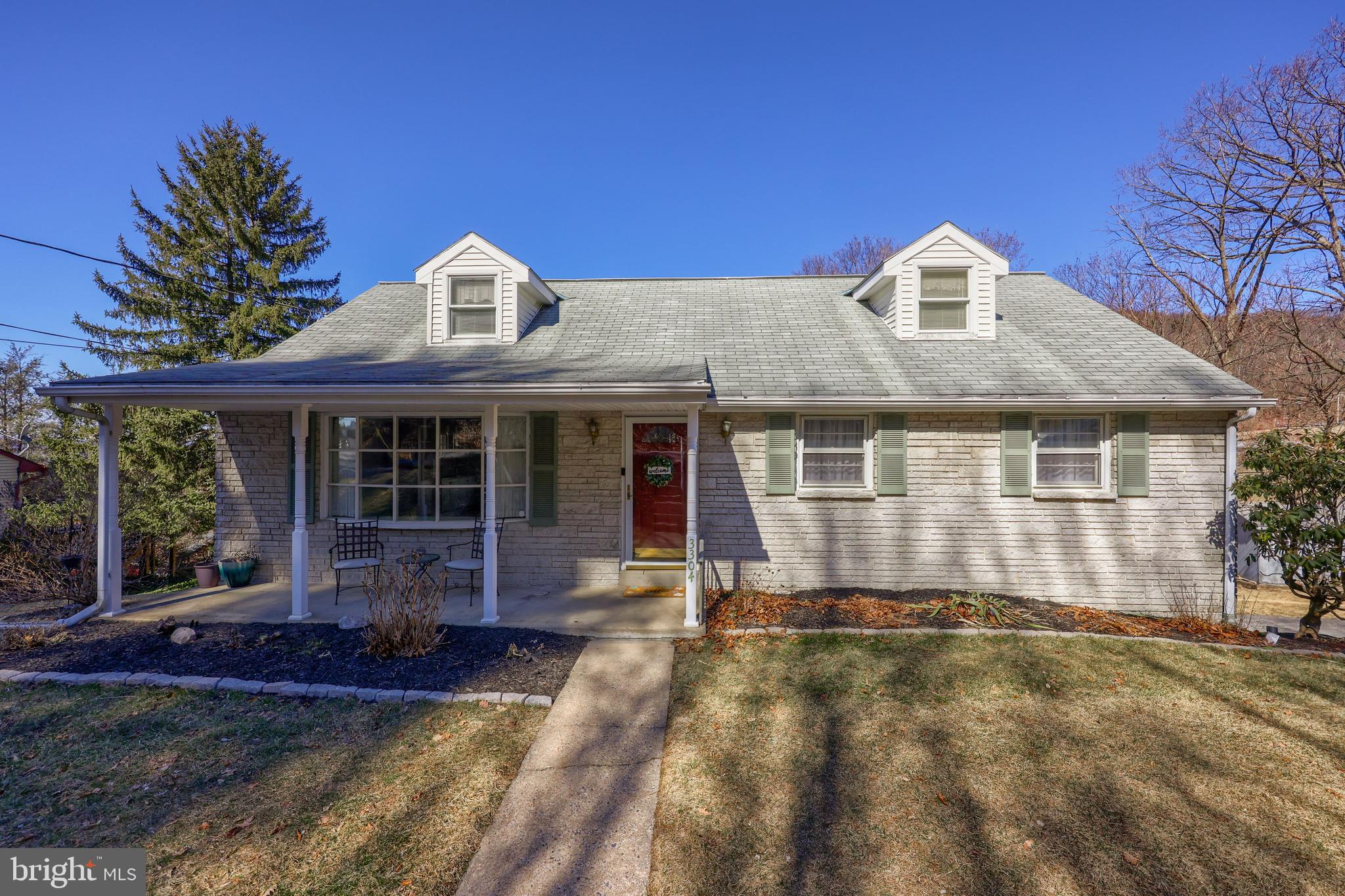 Welcome home to this spacious Cape Cod located on over half an acre on a private lot in the Muhlenberg School District. The first-floor is move-in ready -- you'll love the hardwood floors throughout! The living room is a nice size and flows into the eat-in kitchen, which is appointed with built ins for added storage. The kitchen features granite counter tops and an island with seating for three. From the kitchen you can exit onto the HUGE deck which spans the entire length of the home. This is the perfect place to sip your morning coffee while taking in the view or to entertain your family & friends this summer. Back in side, you'll find a hallway off of the kitchen leading to the full bathroom, as well as two bedrooms. The first floor primary bedroom is huge! It was originally two bedrooms converted to one, so it has two nice-sized closets for even the biggest of wardrobes. This room could also easily be turned back into two separate rooms, if you need the additional bedroom space. Upstairs you'll find two additional bedrooms (one of which is a walk through, easily changeable) with charming, dormered ceilings and lots of closet storage. The daylight, walkout basement has a cozy family room with a brick, wood-burning fireplace. The family room leads to a spacious patio underneath the deck for even more outdoor living space. There's also an updated half bathroom conveniently located off of the family room and a spacious laundry room with plenty of room for storage. You'll love having a large 2-car garage plus plenty off-street parking in the driveway. There's also a shed for additional storage. This home feels tucked away, yet is close to Route 12 for an easy commute and is close to lots of shopping and restaurants. **An offer has been received. Seller's are asking for bet & final offers by Saturday, March 8th at 5:00pm.**