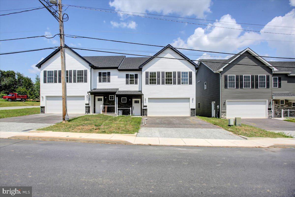 ****$10,000.00 towards Closing Costs****Armory Estates! The borough of Waynesboro's newest community! Perched on top of the hill, off Grandview Ave, this property was once apart of the historic National Guard Armory! This duplex offers over 1900 square feet of finished space. The entry level features an open floor concept, with living, dining area, and kitchen all open. Kitchen has granite countertops, and stainless steal appliances. There is an attached 2 car garage and a 1/2 bath on this level. Upstairs you will find 3 oversized bedrooms, including a master suite, with bathroom, and walk in closet. Upper level laundry room, so you never have to carry laundry baskets! Step outside to a small yard, with little maintenance, and a small concrete patio. Schedule your showing today. Other units available, same floor plan, different color options. Contact us today to discuss!