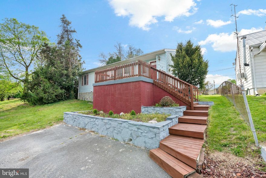 Discover the charm of this delightful ranch-style home nestled in the heart of downtown Martinsburg. Built in 1990, this priced to sell well-maintained residence offers a perfect blend of comfort and functionality, making it an ideal retreat for those seeking a cozy yet spacious living environment. Step inside to find a warm and inviting interior featuring three bedrooms and one and a half bathrooms. The traditional floor plan is enhanced by beautiful hardwood floors and plush carpeting, creating a welcoming atmosphere throughout. The family room, conveniently located off the kitchen, is perfect for gatherings, while the formal dining room adds an elegant touch for special occasions. Enjoy casual meals in the breakfast area or at the kitchen table space, equipped with essential appliances including a dishwasher, electric oven/range, and refrigerator. The property boasts a cleared corner lot, providing ample outdoor space and a serene view of trees and woods. With a partial basement for additional storage and a main floor laundry hookup, this home is designed for ease and convenience. Parking is a breeze with an asphalt driveway accommodating up to four vehicles. Located just a stone's throw from commuter rail stations and lots, this home offers easy access to transportation while being surrounded by the vibrant energy of downtown living. Experience the perfect blend of comfort, convenience, and community in this charming Martinsburg gem.