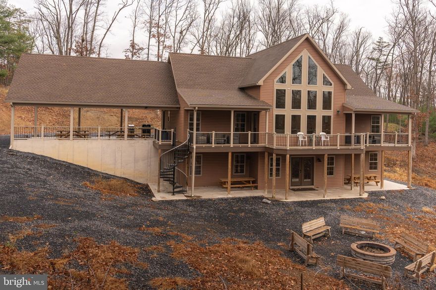 OPEN HOUSE FOR 02/15/2025 CANCELLED DUE TO WEATHER! Call the listing agent with any questions! Stunning 5,000 sqft luxury cabin just steps from Raystown Lake in the desirable Seven Points area. Built in 2021, this 4-bedroom, 4-bathroom home sits on a 2.03-acre semi-wooded lot and offers a unique blend of modern luxury and natural beauty. The property comfortably sleeps 16 guests and comes fully furnished, making it an exceptional short-term rental opportunity with an established annual income of approximately $100,000 and minimal expenses. Additional 2+ acre lot available for purchase at a discounted price if you bundle and buy, perced for a 6-bedroom home, providing expansion potential and added value. The home features year-round access, protective covenants, and no flood plain restrictions. Sale includes all furnishings and appliances. Located in the Juniata subdivision, this turnkey property is ideal for investors or buyers seeking a premium lake retreat.

VIDEO TOUR AT: https://youtu.be/2IeORP-JL5g?si=KirN9O0qz4_e2-wI