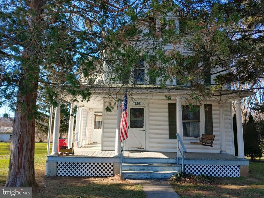 Discover the perfect blend of historic character and modern reliability in this spacious Colonial located in the heart of the Borough of Mercersburg. This home boasts impressive high ceilings and large, airy rooms that are filled with natural light. You can move in with peace of mind knowing the heavy lifting has been done, featuring updated windows and electrical wiring. The interior showcases beautiful hardwood floors across both levels, leading you through a formal living room, a separate dining room, and a functional kitchen equipped with appliances. Upstairs, you’ll find three generous bedrooms and two full baths. Situated on a rare .41-acre double lot (comprised of two deeded parcels (14-3A11.-006 and 14-3A11.-007), the property offers expansive outdoor space with peaceful farmland views directly behind the home. Enjoy the efficiency of natural gas heat and the potential to build equity.  Don't miss this opportunity to own a piece of Mercersburg with room to grow!