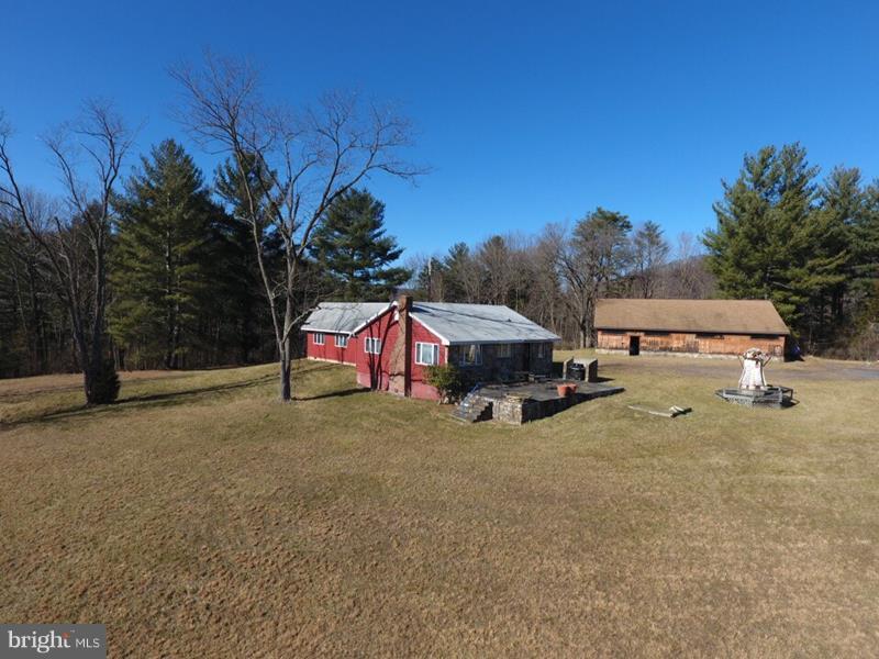 SURROUNDED! 292 UNRESTRICTED ACRES IN THE MIDDLE OF THE GEORGE WASHINGTON NATIONAL FOREST, 92% OF BOUNDARY BORDERS THE GWNF. THIS PLACE HAS IT ALL; MOUNTAIN VIEWS, 3 PONDS, FLOWING SPRINGS, STREAM, FIELDS, VALUABLE HARDWOOD TIMBER AND MOST OF ALL....TOTAL PRIVACY! CABIN IS IN GOOD SHAPE AND COULD BE USED AS A SIMPLE FULL TIME RESIDENCE OR THE ULTIMATE WEEKEND GETAWAY. 40X56 GARAGE/WORKSHOP