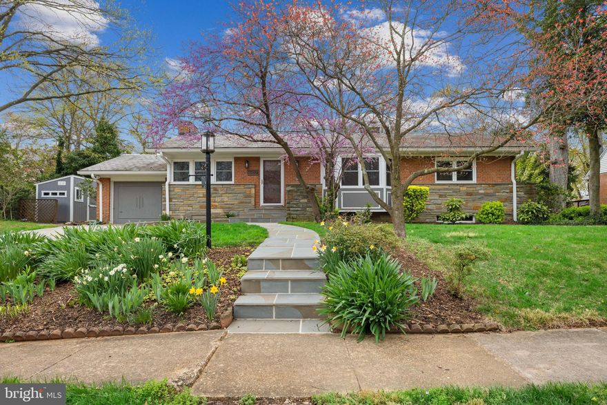Sited on a beautifully landscaped quarter-acre lot along a charming sidewalk-lined street, 7040 Quander Road blends classic craftsmanship and thoughtful updates! Originally built in 1952—believed to be the personal residence of renowned builder Bud Gosnell—this 4 bedroom, 3 bathroom home offers over 3,200 finished square feet across two expansive levels!

Inside, the heart of the home is the chef’s kitchen, fully remodeled in 2016 with white cabinetry, a contrasting gray island, quartz and butcher block countertops, and high-end LG appliances, including a 5-burner gas range and French door refrigerator. The wall between the kitchen and dining area was opened up to enhance the flow and natural light, making it an entertainer’s dream. Features include refinished hardwood floors throughout the main level, and blackout shades and ceiling fans in each main level bedroom. The primary suite underwent a full transformation in 2018, now featuring a spa-like bathroom with heated floors, frameless glass shower, a high-tech Japanese bidet toilet, and walk-in closet.

The fully finished lower level adds flexibility with a legal fourth bedroom (egress window added in 2023), updated full bath, new vinyl flooring, and a fully equipped kitchenette to make this space the perfect for guests, in-laws, or potential rental income. Two cozy gas fireplaces (one with a 2023 insert) bring warmth and ambiance to both levels.

Outside, the home's curb appeal captivates with its slate roof, flagstone walkway, and a striking front facade of brick and stone. The rear exterior continues to impress with durable Hardie siding and brickwork. Included with the property is Outlot C, providing a combined lot size of over 10,940 square feet (0.2511 acres). A resurfaced pool (2019) with new coping, heater, filter, and pump sits within a thoughtfully designed yard featuring a custom round patio, expanded stair landings, and lush privacy. The garage has been fully finished and climate-controlled with a mini-split system, offering ideal space for a workshop, gym, or studio.

Every major system has been updated: electrical panel (2015), tankless water heater (2018), AC (2021), sump pump (2023), and more. Even the doors, windows, and door hardware.

The wonderful HEATED Pool has a safety fence that is easily installed and will convey with the home!

With just four owners since it was built, this home has been lovingly maintained and meticulously upgraded.  This home is centrally located with easy access to local shopping and retail, local parks, rec center, and just a few miles to National Airport and Washington DC.

Offers, if any, will be reviewed Monday 4/7 at 4 PM