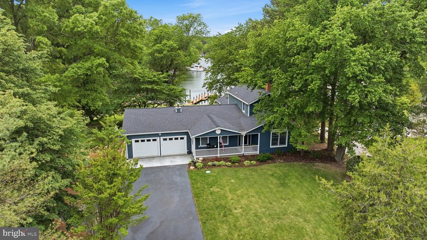 COMPLETELY UPDATED & IMMACULATELY MAINTAINED!!! Stunning waterfront 3 Bedroom 2.5 Bath 2378SQFT  retreat on sought after Cuckold Creek in Hollywood, Maryland!

There’s something about pulling into this property that immediately slows you down. Maybe it’s the way the trees wrap the .64-acre lot, or how the home sits back just enough to feel private without feeling isolated. Either way, you can tell right away — this isn’t just another waterfront home.

Step inside and the feeling continues. The space opens up, ceilings lift, and natural light pours in across engineered white oak hardwood floors that run seamlessly throughout the home, creating a clean, cohesive feel from room to room. It’s the kind of space that feels elevated without trying too hard.

The kitchen is positioned perfectly to capture substantial water views, making it a place you’ll actually want to spend time in. Finished with leathered Fantasy Brown countertops and designed to flow naturally into the main living areas, it connects effortlessly to both everyday living and entertaining. Just beyond, the family room offers a more relaxed setting, anchored by a wood stove insert that brings warmth and character during cooler months.

The main-level primary suite is tucked away for privacy and convenience, offering a comfortable retreat at the end of the day. Upstairs, two additional bedrooms are connected by a beautifully finished Jack and Jill bathroom, creating a layout that works seamlessly for guests or family.

And then there’s the way this home lives outside.

The screened-in porch is the kind of space you’ll use constantly — vaulted wood ceilings, a true extension of the home, and a place where time just seems to slow down. Step out onto the 24x12 deck and the setting really opens up, overlooking the backyard and the water beyond. A small fenced area with a dog door adds everyday functionality, blending convenience with the outdoor lifestyle.

Follow the gentle path toward the water and you’ll find a private pier set on Cuckold Creek with approximately 5 feet of mean low water, a 12,000 lb boat lift, and a dedicated kayak rack — everything you need to actually enjoy being on the water. The shoreline has already been protected with new rip rap installed in 2024, giving peace of mind for years to come.

Back at the home, the details that matter are already handled. The roof was replaced in 2020, and the property is supported by a crawlspace dehumidifier, oil backup heat, and an efficient heat pump hot water heater. The oversized two-car garage is complemented by an additional rear garage bay with a roll-up door, offering the kind of storage or workspace flexibility that’s hard to find. A large laundry and mudroom adds everyday practicality, designed for real life coming in from the outdoors.

Every part of this home has been thoughtfully considered — from the way it flows, to the way it functions, to the way it allows you to actually enjoy the setting around it.

Schedule your private showing today — this one won’t last.