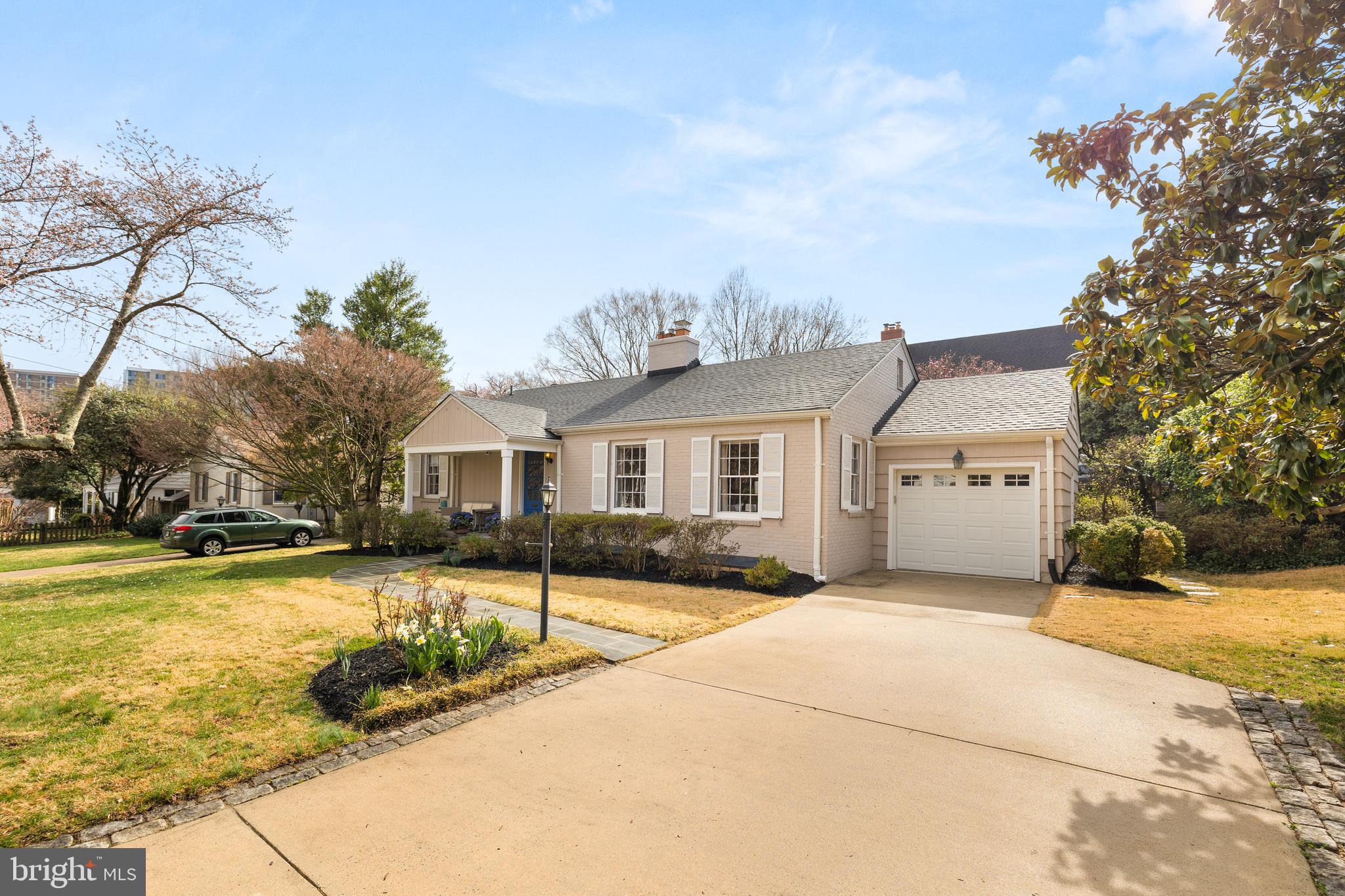 NEW LISTING! Welcome to this picture perfect home in the heart of Somerset, one of Chevy Chase’s most sought-after neighborhoods. This fine home boasts 4 bedrooms and 3 full bathrooms, set on a sprawling corner lot with an assortment of flowering trees and lush green grass.
Upon approach you will love the extra wide driveway, and charming front porch with beautiful blue front door and matching potted hydrangea. Once inside, a welcoming entry foyer complete with generous coat closet leads into the spacious living room with sunlight streaming in from multiple directions. Hardwood floors, crown molding and a brick, wood-burning fireplace provide warmth to the space. Just beyond the living room is the generous dining room which is ideal for both large family gatherings, as well as intimate dinner parties. French-style doors open into the bonus sunroom that makes an ideal home office, playroom, your choice!
The sparkling white kitchen can easily be opened up to create the gourmet kitchen of your dreams. Sliding doors lead into the fully fenced, private back garden, where there is a large terrace for cocktail parties, fire pit evenings, book club lunches, the possibilities are endless.
Three bedrooms and two full baths, including an en-suite primary bedroom are all located on the main level. The walk-out lower level features light, oak-colored floors, high ceilings, a family room, bedroom, full bathroom, and a wood-burning fireplace. There is also a large laundry/utility room with generous storage. The attic is accessible via a fixed set of stairs, and there is plenty of room for storage, as well as the possibility for easy expansion. An attached one-car garage completes this delightful home.
Don’t miss this extraordinary opportunity to live in this very special neighborhood. Steps to the shops and Red Line Metro at Friendship Heights, Whole Foods, Trader Joe’s, the award-winning Somerset Elementary School. Somerset is known for its strong community, walkability, quiet setting, and popular Somerset Pool, just one block away. All this, and more make this home a smart choice for today’s homebuyer.