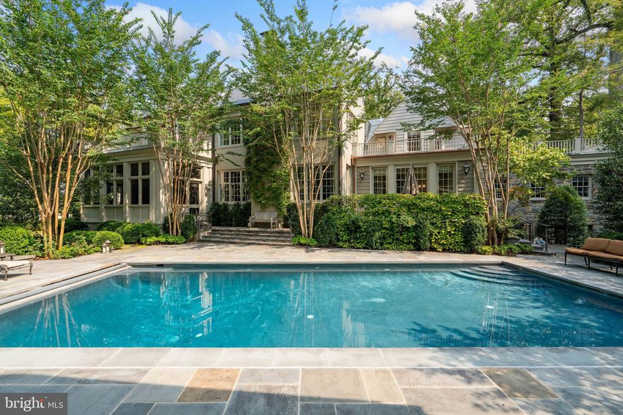 This spectacular home is located in Spring Valley on Indian Lane, one of the most prestigious streets in the entire metropolitan area. Set on an elegant half-acre lot, the home once owned by five-star Army General and the first Chairman of the Joint Chiefs of Staff General Omar Nelson Bradley has been carefully and meticulously renovated by its current owners. Utmost attention was given to every detail of the renovation, which features a custom home theater, geothermal utilities, an elevator, a wine cellar, custom millwork and finishes and many other state of the art features. With almost 11,000 square feet of living area, this home is beautifully finished and offers the ultimate in everyday living and entertaining spaces, including generous room sizes, high ceilings and fabulous, balanced flow. The generous and deep center hall foyer opens to spacious formal rooms, and a rounded sun room is located off the living room. A chef's kitchen with breakfast room is adjacent to a beautiful family room with coffered ceilings, and a truly special billiard room with intricate detail is also located on the main level. A butler's pantry, mud room and two-car garage are also found here. The second level features five bedrooms and four full baths, including a wonderful master suite with access to two private offices, a walk-in closet, and a sumptuous bath. Two additional bedrooms and bath are on the third level. The lower level includes a custom home theatre, wine cellar, guest suite, recreation room with kitchenette and access to the pool, as well as a gym, laundry and storage room. The beautifully landscaped grounds boast a heated pool and pool house, screen porch overlooking the pool, terraces and patios, play area and a circular drive to the front of the home.  Commutes to DC, MD and VA are incredibly quick from this location, and residents enjoy the nearby amenities, shops and restaurants of Spring Valley, Palisades and more. This unparalleled property presents a rare opportunity in our marketplace.