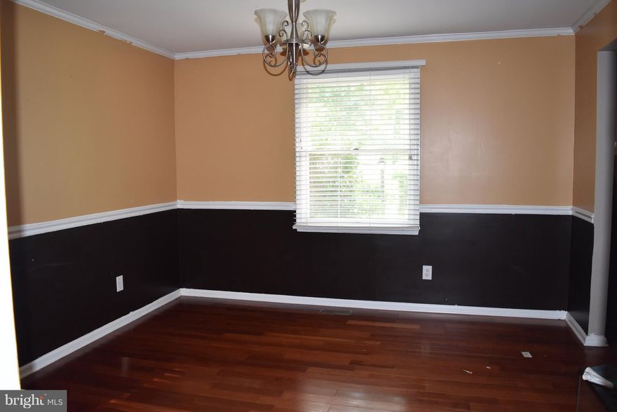 Large one story rambler in amenity filled gated neighborhood. Large level lot in first section.  Walking distance to tennis & basketball courts, jogging trail, swimming pool and marina.   Home is being sold "AS-IS"  No VA or FHA financing