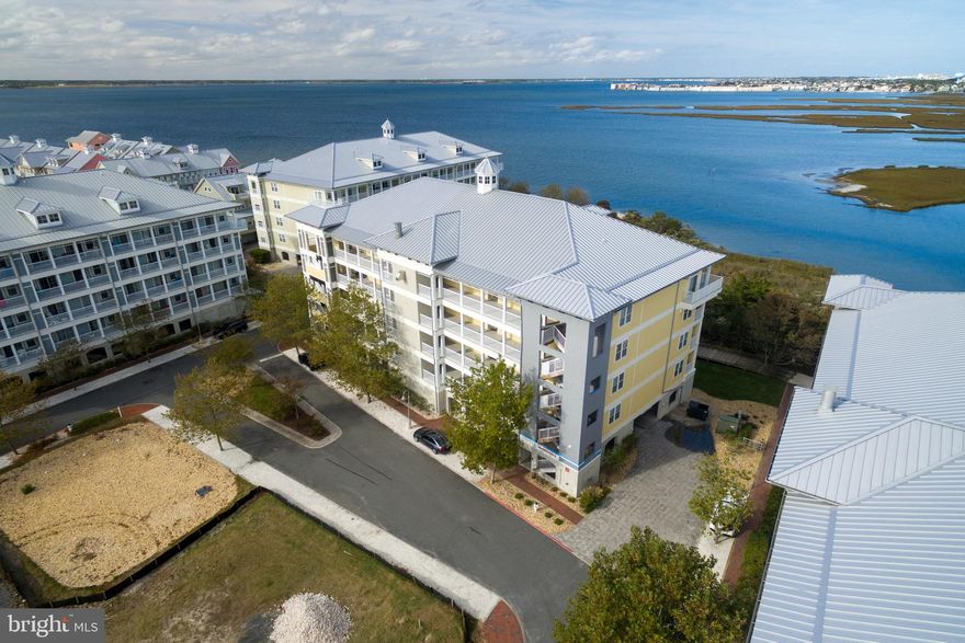 Sunset Island, a 37-acre private community on 67th Street with fun for the whole family...Indoor & Outdoor Pools, Bayfront Dining, Fitness Center, Locker Rooms, Saunas, General Store, Walking & Bike Path, Fishing & Crabbing Pier, Bayfront Beaches, & Interactive Fountains.  End unit with a stunning view of the bay! Newer balcony furniture included.  Walk to the ocean or enjoy one of three bayside beaches * Parking for 2 vehicles- one is an assigned, covered space. Also, all bedroom carpet was replaced 1 year ago & hot water heater replaced in November 2022.  Awesome rental history too!