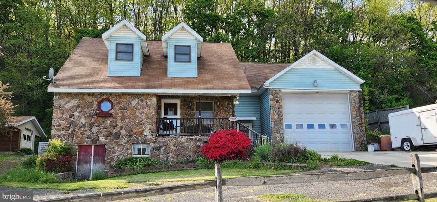 Wow....No City Taxes....Outside the City Limits!!!  This one could be your forever home!  Stone and vinyl siding cape cod features Living Room, Dining Room, Kitchen, Bedroom and Full Bathroom on the first floor.  Second floor consists of 2 Bedrooms and Full Bathroom .  There is a full unfinished basement, oversized two car garage with high ceiling (perfect for your oversized vehicle or camper) with a storage room over the attached garage.  There is also a one car detached garage with its own porch.  Just imagine having coffee on the front covered porch or private rear open patio.  Come take a look!!!  This is an Estate Sale.  Property Being Sold In As-Is Condition.