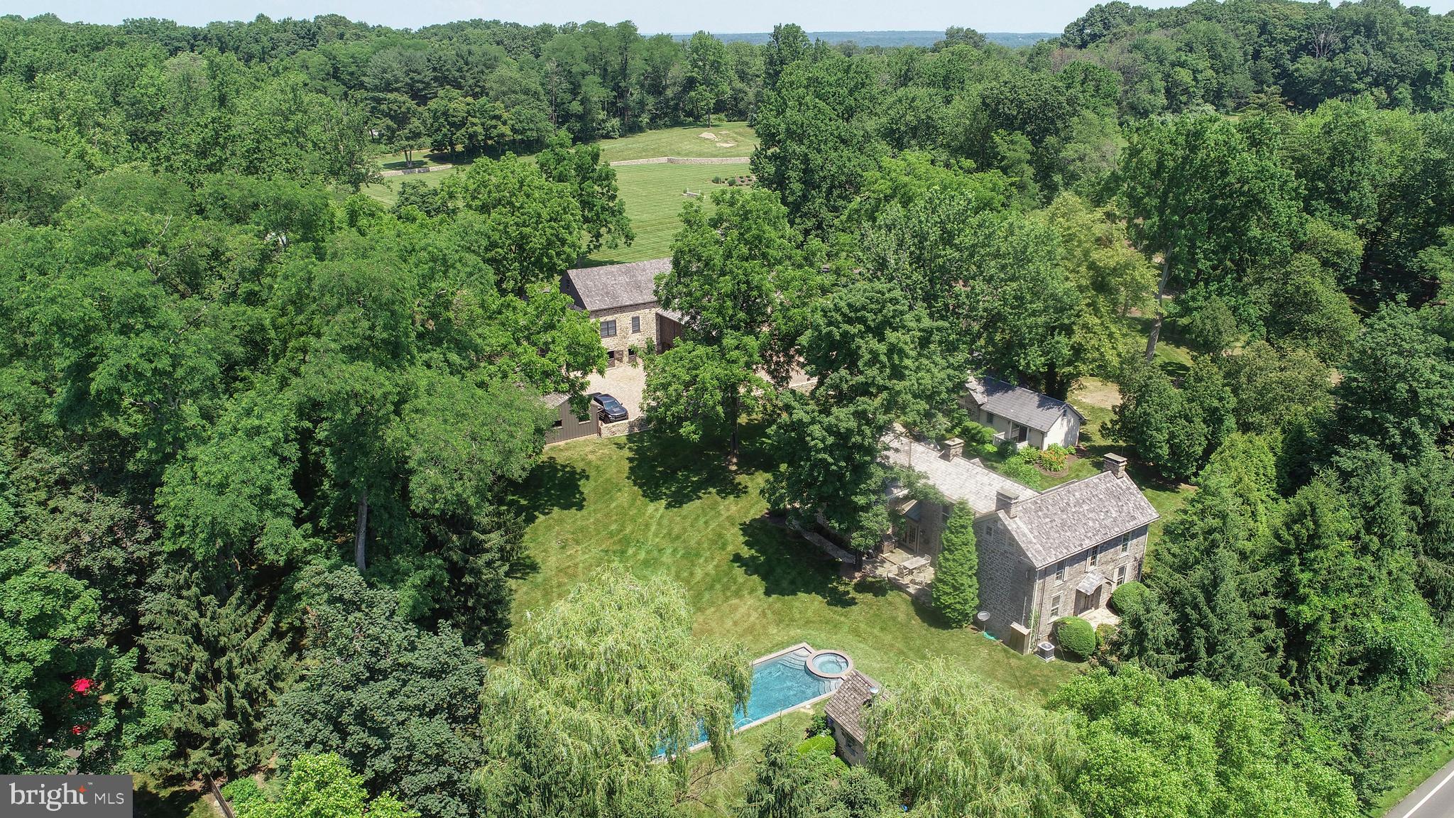 Welcome to Heathman Farm, New Hope, Bucks County! Tucked behind a magnificent Bucks County fieldstone perimeter wall is this true Olympic-caliber equestrian facility with renovated and expanded four-bedroom stone farmhouse built in 1788, separate guest quarters, grooms apartment and heated pool and spa. On 29.19 acres, this training ground for some of the world's most cherished and valuable horses was designed by a championship course designer from Holland. The property not only offers a grass grand prix jumping course with irrigation, but also 7 turnouts, outdoor arena, an indoor riding ring with new GGT footing, a Horse-Fit 6 horse hot-walker, and 17 stalls on property, outfitted with every accoutrement necessary for those who desire only the best accommodations and equipment for their equine animals. The main home has been expanded to include a chef's kitchen, a spacious, climate-controlled wine cellar and a sumptuous master suite. Take in this home's magnificent grounds from its heated pool and spa. With breathtaking views, aesthetically and professionally, you will find no other equestrian facility in Solebury Township that compares to Heathman Farm.