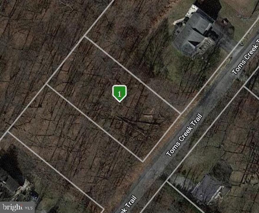 CONVENTIONAL PERC APPROVAL!  Fantastic half acre lot, just steps from the MD/PA line.  Backs up to a large privately owned & wooded parcel- which should mean lots of seclusion & privacy!  Lot is located just 3 properties away from the end of Toms Creek Trail = very low traffic flow.  Currently wooded.  Perc was just performed Oct 2022! Conventional septic percs are rare these days & cost less to install than typical sand mound systems!