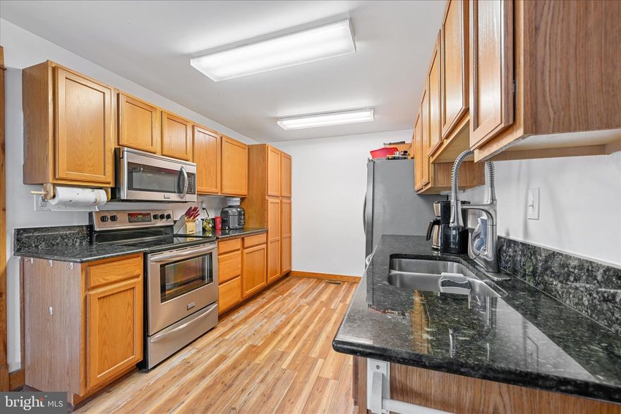 Seller is offering up to $5000 towards closing to buyer with an acceptable offer! Welcome to Middleborough! This move-in ready home features 3 bedrooms and 2 full baths. The primary bedroom, second bedroom, and laundry are conveniently located on the first floor. Additional privacy offered to the second floor where you can find a third bedroom, or additional living space, with a full bathroom.  The eat-in kitchen offers stainless steel appliances and access to the back deck.  Your fur babies can enjoy the fenced in yard while you relax on the deck or in the 12x24 ft saltwater pool. The enclosed front porch with brand new front exterior door provides additional living space. The unfinished basement gives you plenty of room for storage. This home is centrally located in eastern Baltimore County giving you quick and easy access to major highways, restaurants, schools, parks, nightlife, and water ways. Enjoy all these conveniences while still being within a community. Make this home yours today!