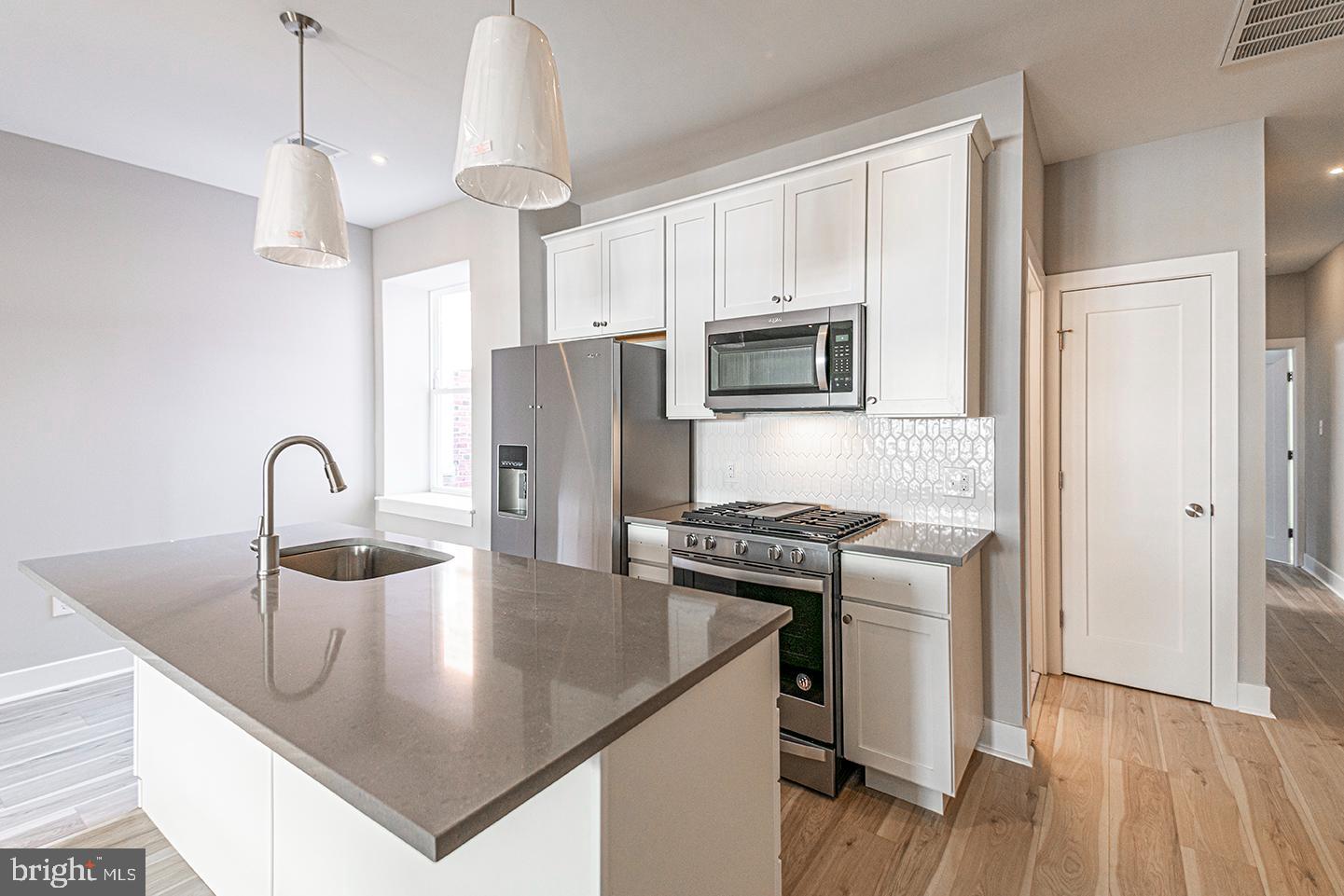 Fully-occupied, income-producing duplex in West Philadelphia with $3,345/month in gross rental income and about 5 years of remaining tax abatement. Each unit offers 2 bedrooms and 2 full bathrooms, fully renovated in 2020 with modern finishes throughout. Features include quartz countertops, stainless steel appliances, central air, in-unit laundry, recessed lighting, and hardwood flooring. The upper unit enjoys a private balcony, the lower unit has private rear outdoor area, while both units include open-concept layouts and spacious closets.
Unit 1 is leased for $1565/mo + $70 utility fee, and Unit 2 is leased for $1625/mo with an $85 utility fee, for a total of $40,140/year in gross scheduled income - an in-place cap rate of 7.5%. Ideal turnkey investment with strong rental history and minimal maintenance. Located on a quiet block with convenient access to public transit, major universities, and commercial corridors.
Turnkey cash-flowing asset in appreciating West Philly submarket. Perfect for investors or 1031 exchange buyers, as well as owner-occupants looking to live in one unit and rent the other. Showings available by appointment with minimum 48 hour notice.