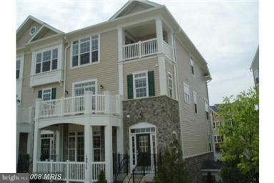 Stunning 3 level townhome in gated community. Former model home, this place is gorgeous!  Huge master suite with balcony takes up entire top floor. Middle level has an impressive living room with fireplace, dining room + kitchen with granite counter tops + stainless steel appliances. Garage level has two bedrooms, full bath + laundry room. Close to shopping, restaurants, commuter lots + I-95!