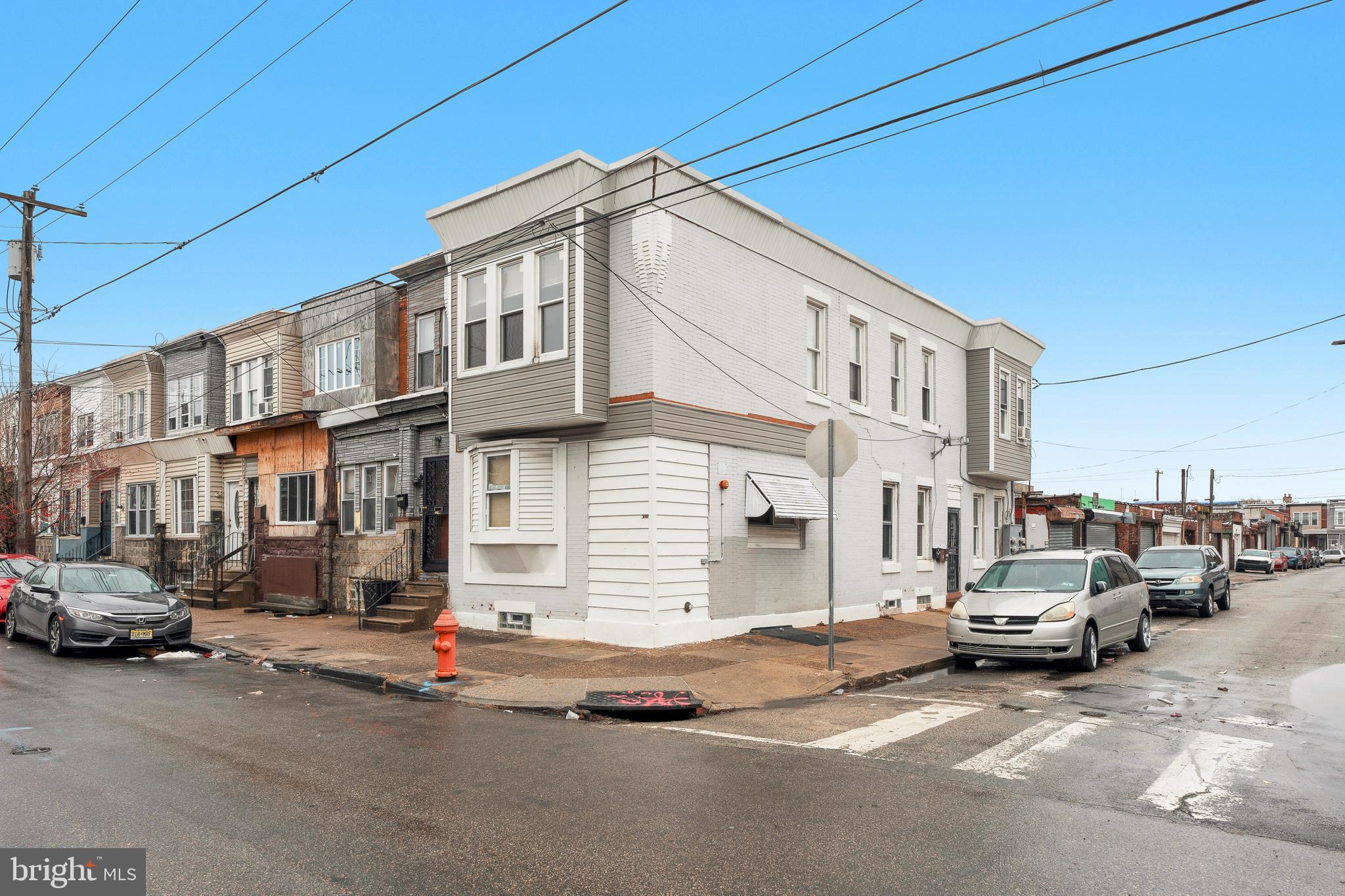 This fully legally zoned triplex in Harrowgate offers a fantastic opportunity for both investors and owner-occupants looking to generate rental income. Featuring a fire suppression (sprinkler) system that is fully operational and inspected annually, this property is both secure and well-maintained.
The first-floor unit (1A) is a spacious 2-bedroom, 1-bath apartment with private access to part of the basement and an in-unit laundry space, currently rented for $1,150/month. Upstairs, Unit 2A is a 2-bedroom, 1-bath that was previously rented for $850/month, while Unit 2B is a studio with a private bath, last rented at $675/month. The owner's portion of the basement offers valuable private storage space with a separate entrance through the cellar, adding even more functionality to the property.
This all-electric triplex is designed for efficiency, with separate electric meters for each unit—including the owner's basement space—individual water heaters, and electric baseboard heating, cooking, and hot water. The fire suppression system has its own dedicated water line, ensuring compliance and safety.
Whether you're looking to live in one unit while offsetting your mortgage or seeking a profitable rental investment, this property is move-in ready with strong income potential.